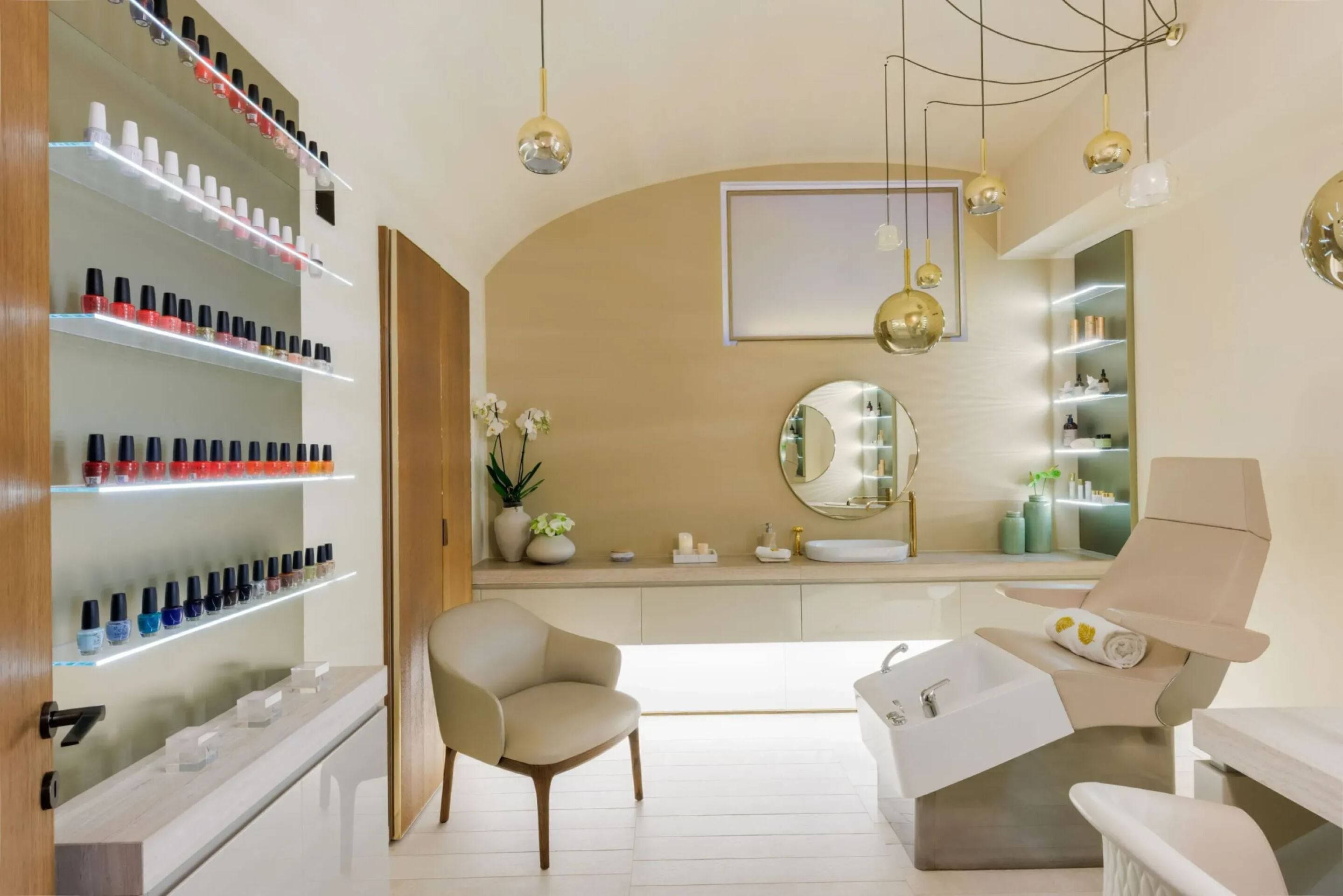 Nails suite at The Eden Spa, with a wall of colourful nailpolish and a confortable chair when you can get you manicure and pedicure done.