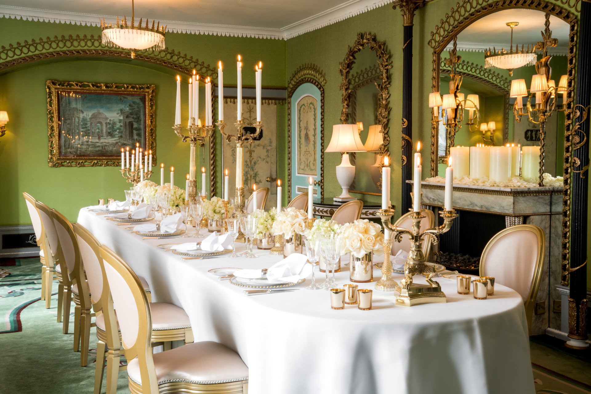The Dorchester-Pavilion set up dinner with white flowers down the table and cut crystal glassware with candelabras 