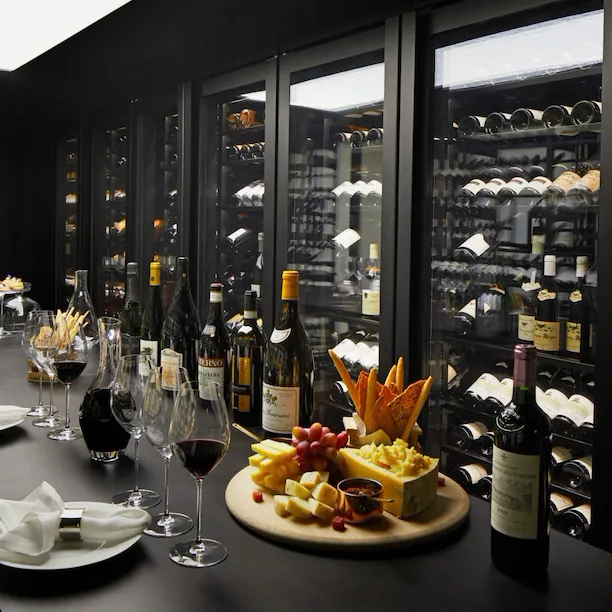 The Dorchester The Wine Vault, red wine being poured and cheese and fruit