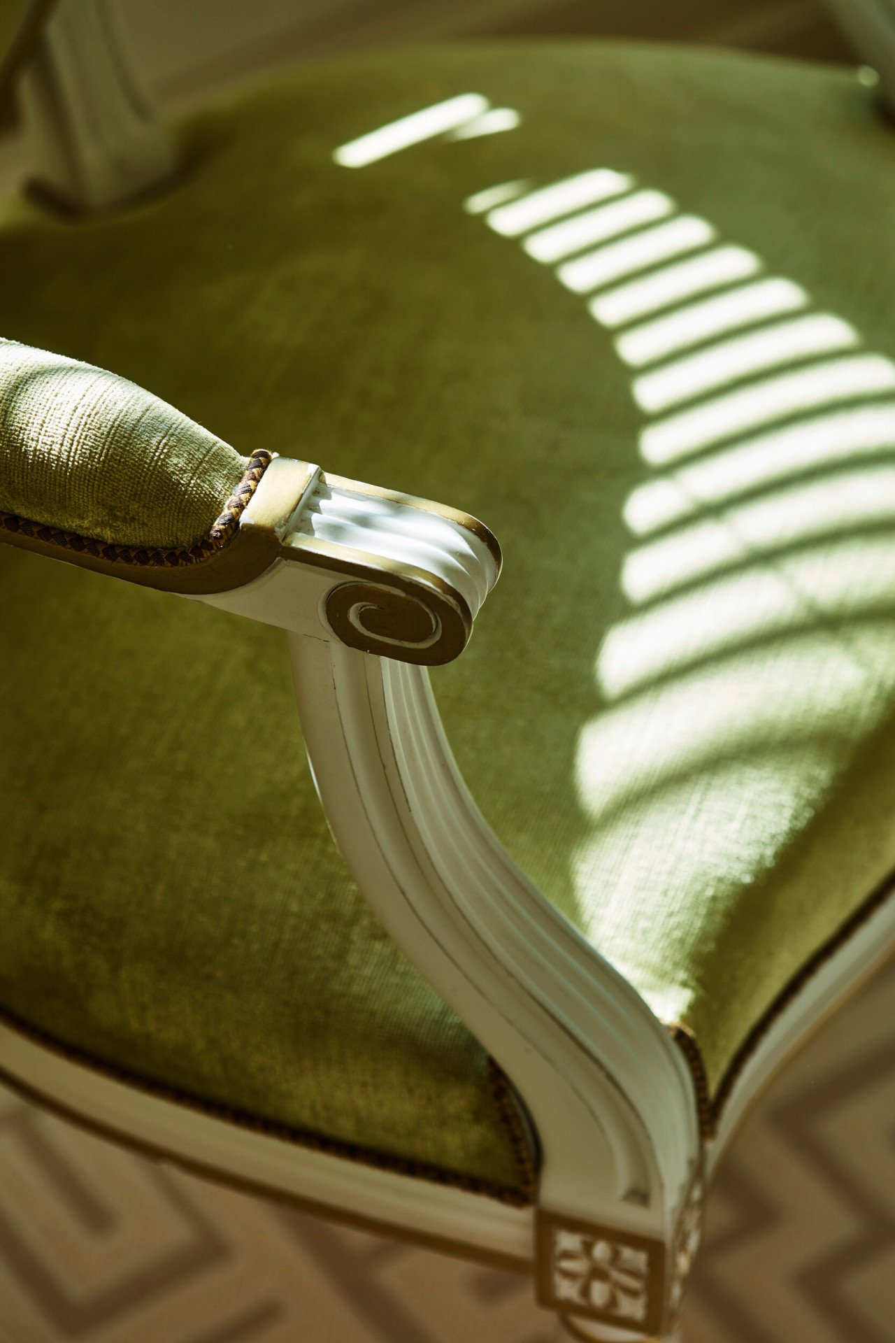 Chair with green fabric in the Parisienne suite, at Le Meurice, Paris.