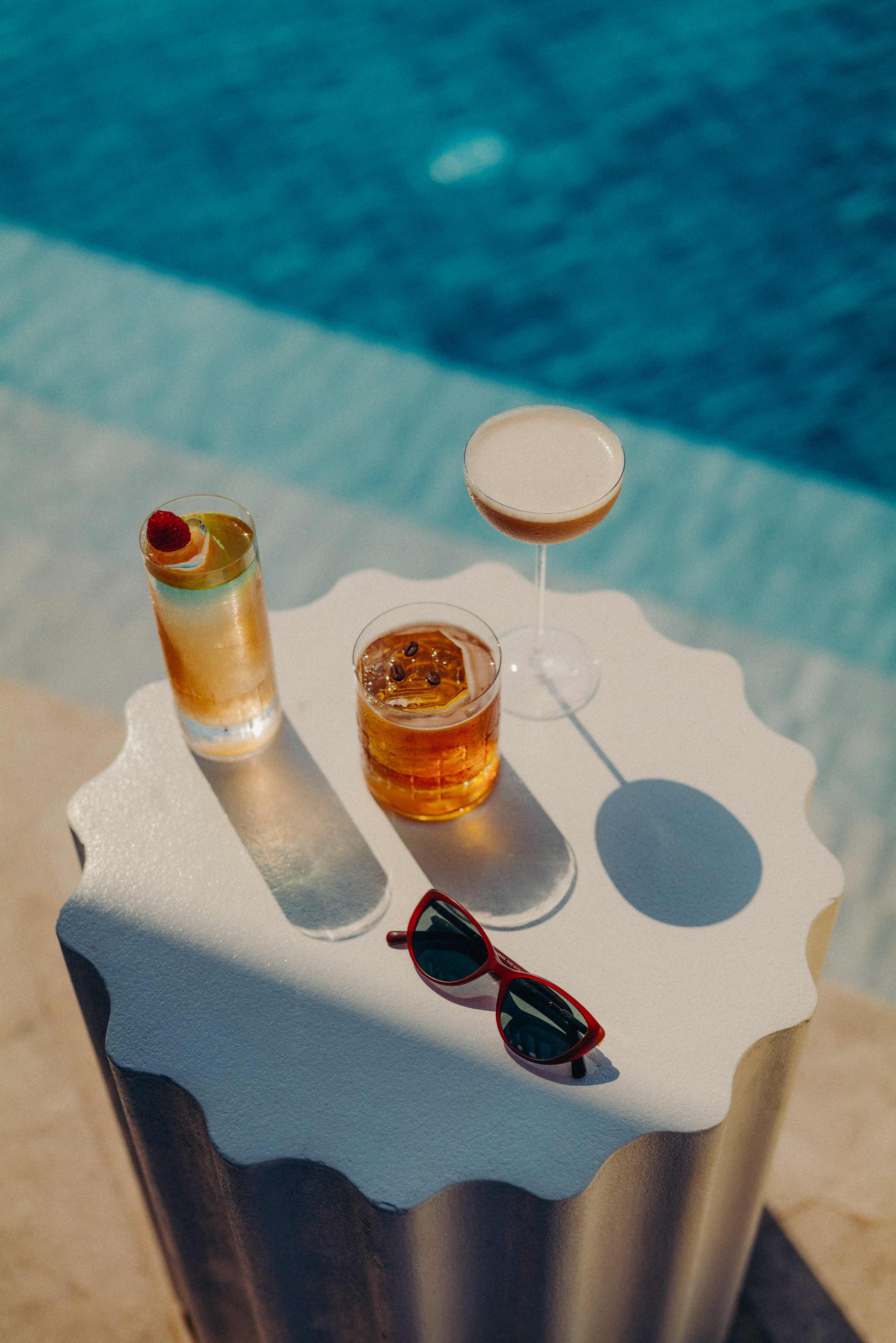 A selection of drinks in High Society's table by the pool