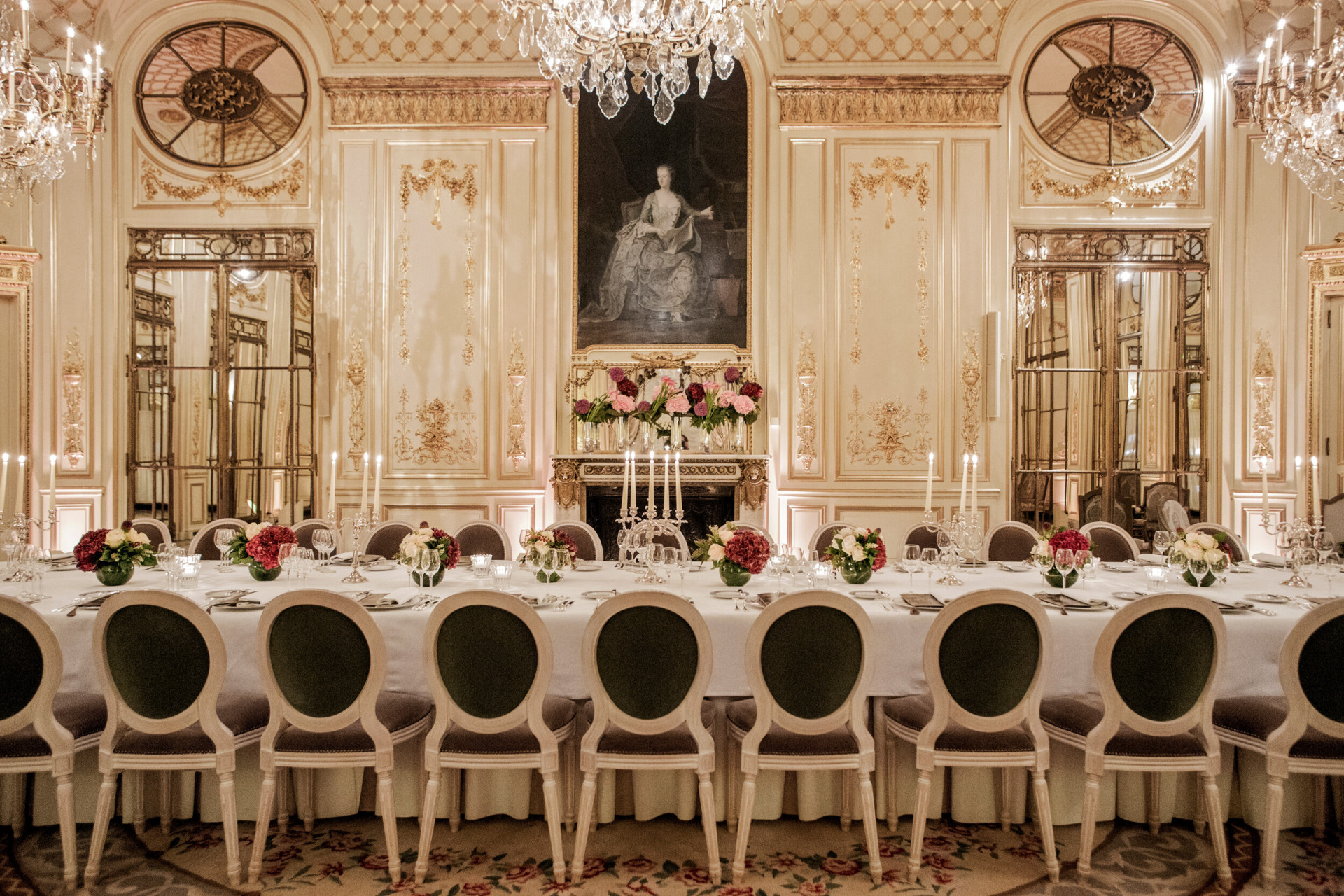 Photo of Salon Pompadour bright Versailles-style event room, set for dinner with round and large dressed tables at Le Meurice, Paris