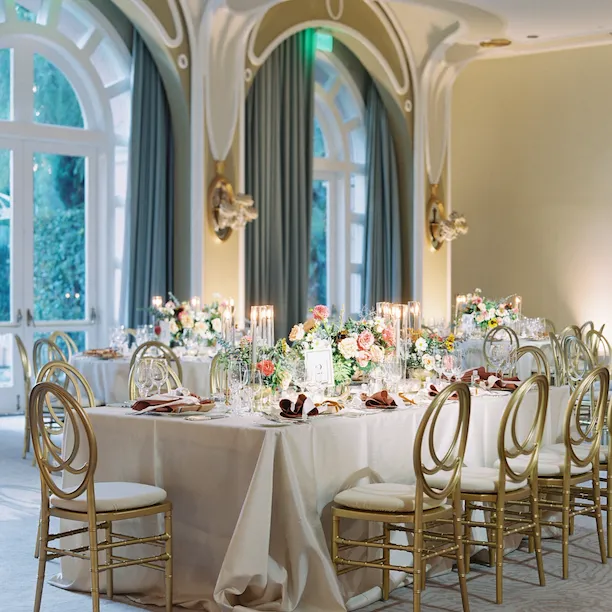 Private event with elegant table setting and natural light in the Crystal Ballroom at The Beverly Hills Hotel