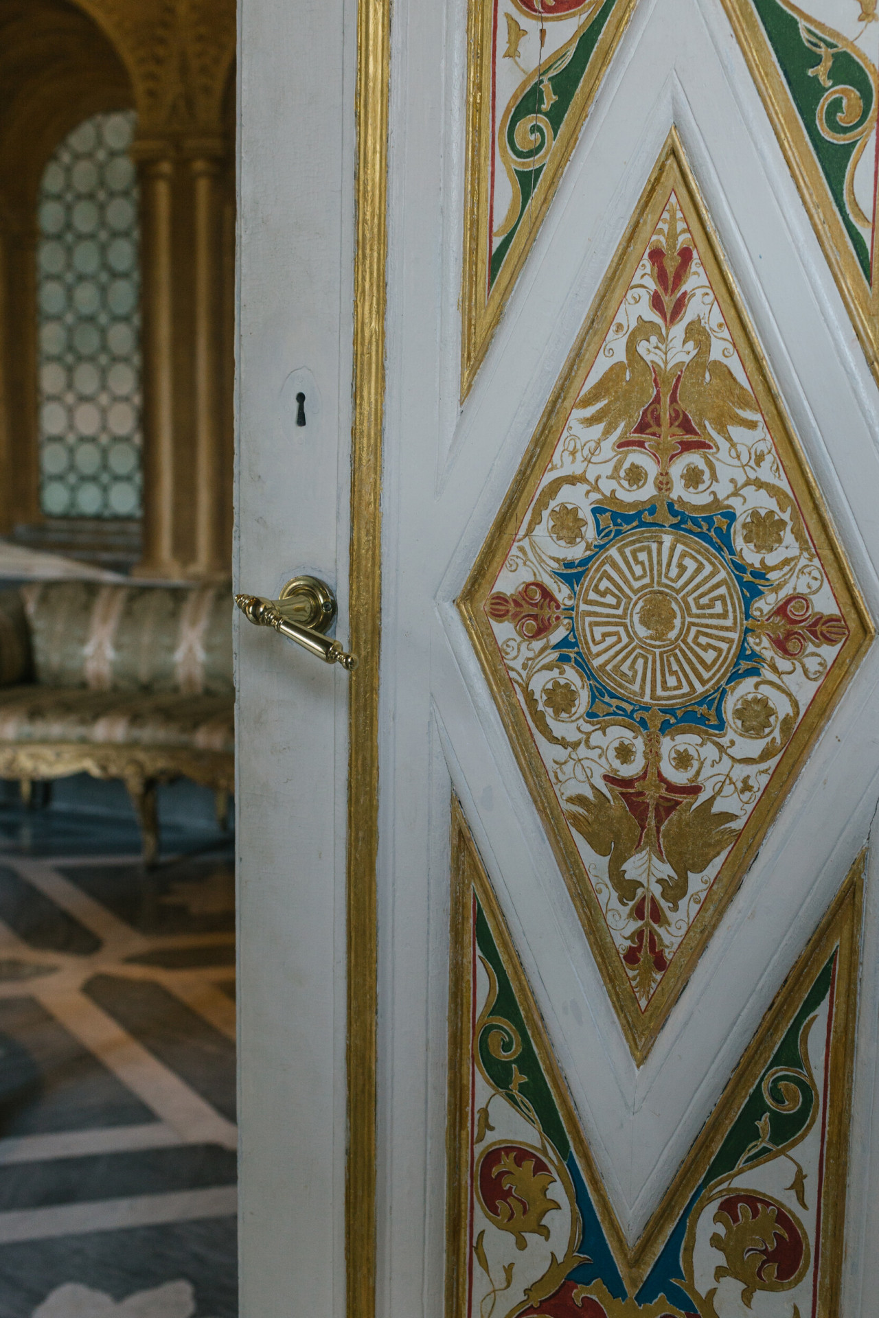 Door with gold trim inside Villa Torlonia in Rome