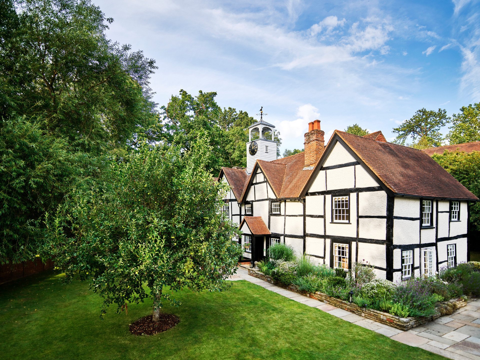 Facade of Dower House in summer at Coworth Park, Ascot