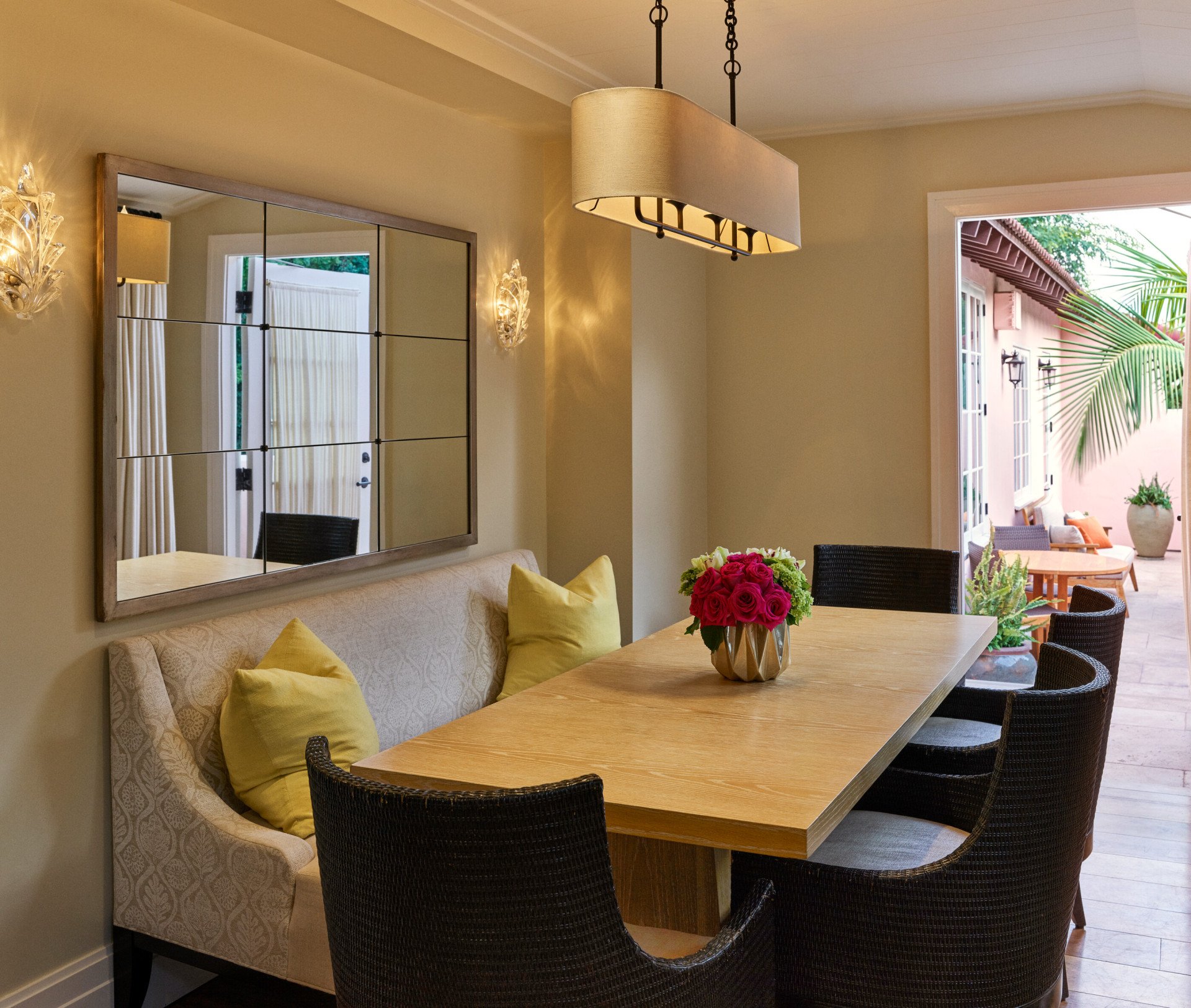 Private dining area with table and chairs inside the bell suite at Hotel Bel-Air, leads to patio