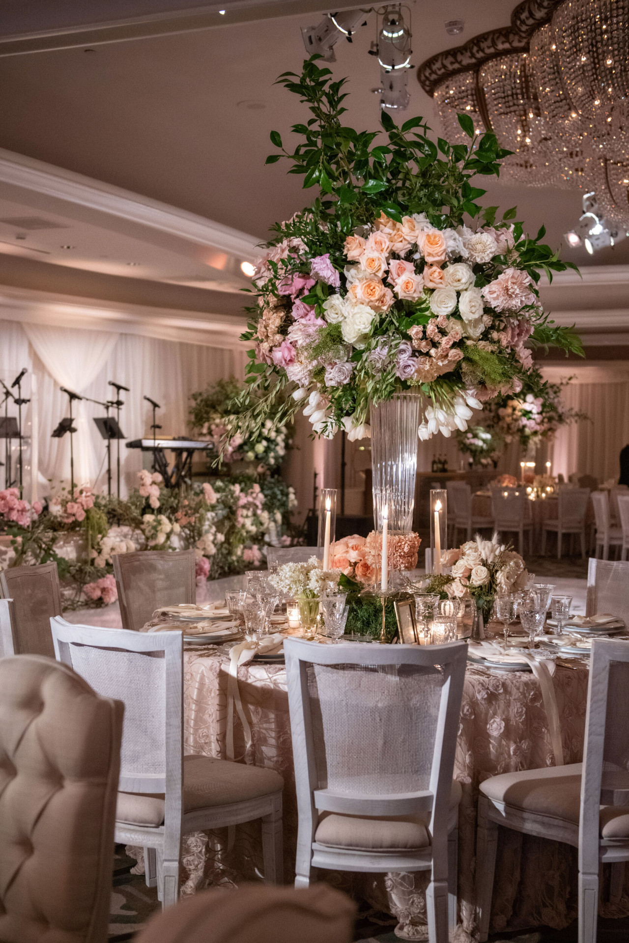 Grand floral centerpieces with shades of pink and white for a Rodeo Ballroom reception at The Beverly Hills Hotel