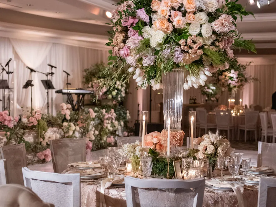 Grand floral centerpieces with shades of pink and white for a Rodeo Ballroom reception at The Beverly Hills Hotel
