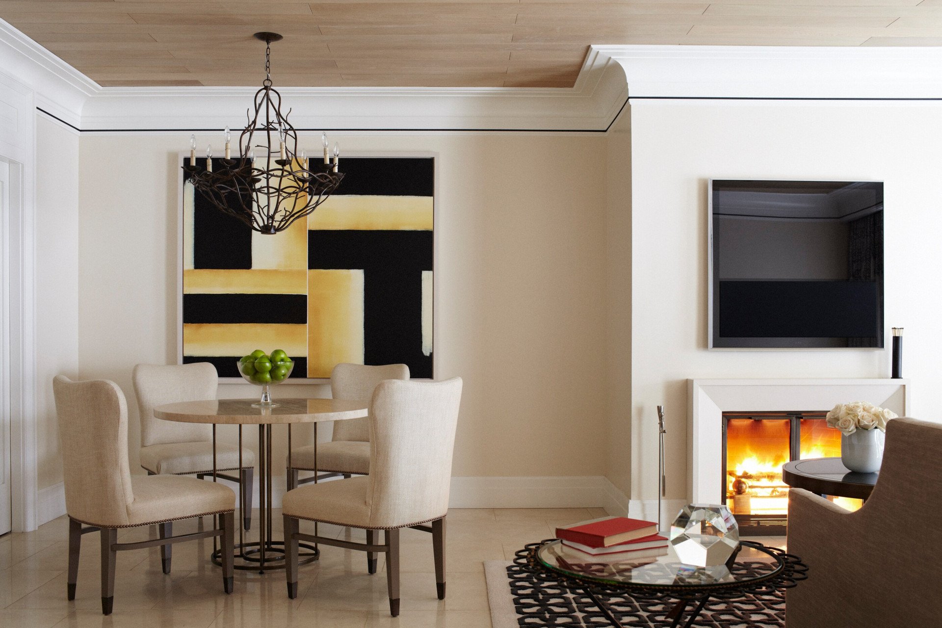 Dining table for four in the Stone Canyon suite with fireplace