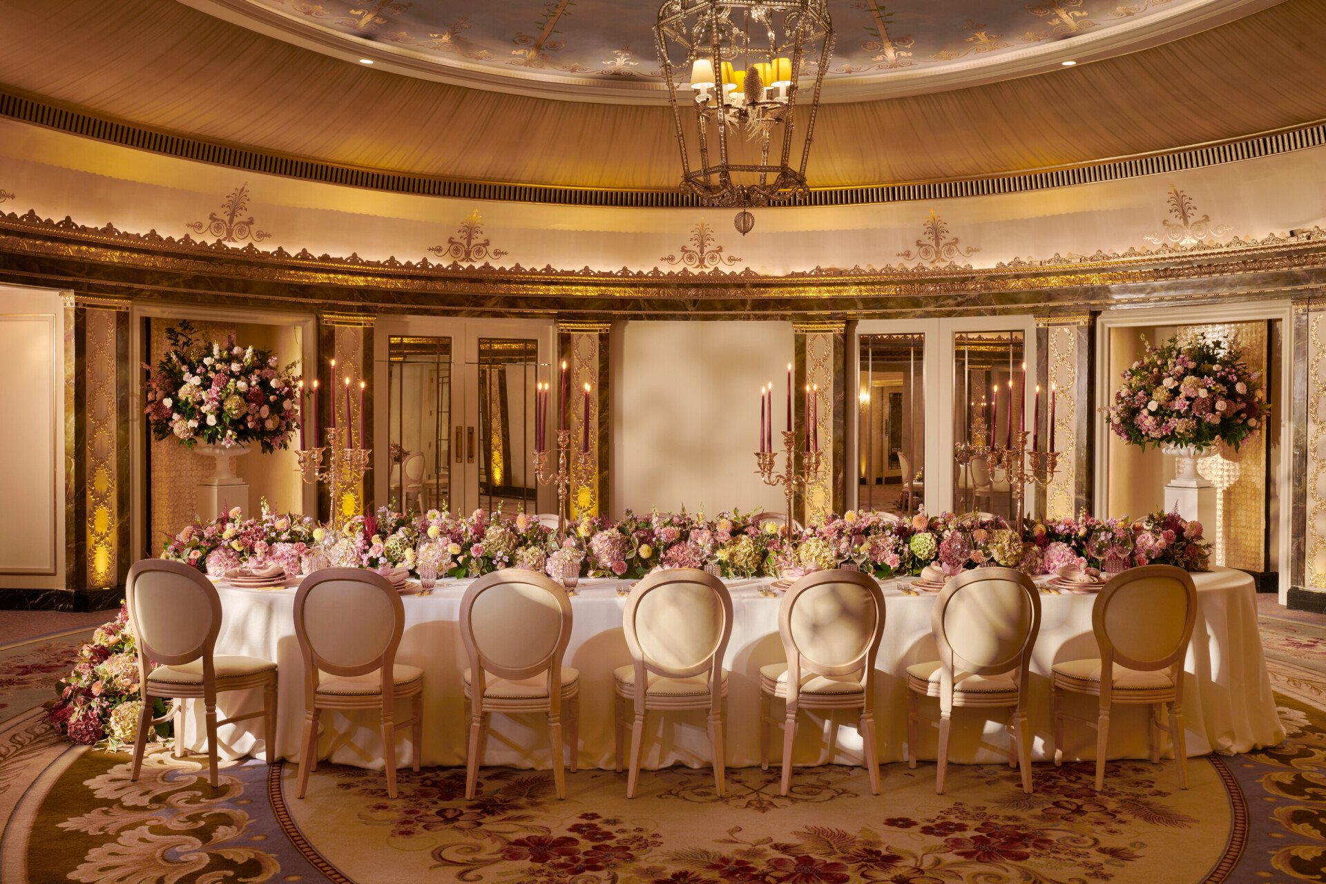 The Dorchester Gold and Silver event space set of  fabulous evening event with a stunning floral centre perice