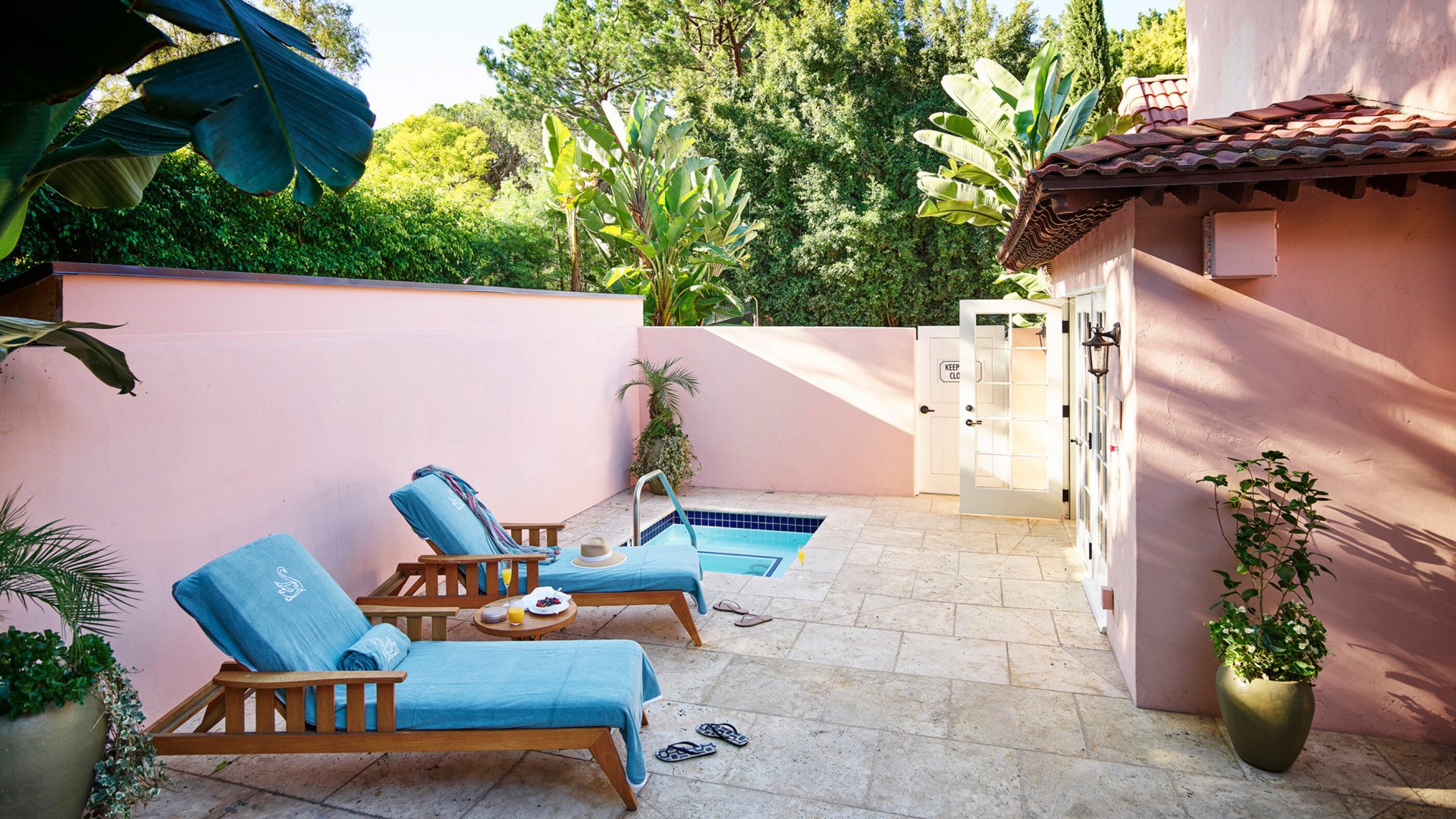 Patio area of the Patio Suite with plunge pool and two pool loungers at Hotel Bel-Air.