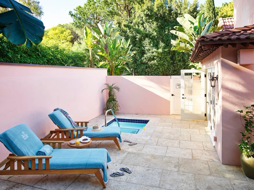 Patio area of the Patio Suite with plunge pool and two pool loungers at Hotel Bel-Air.