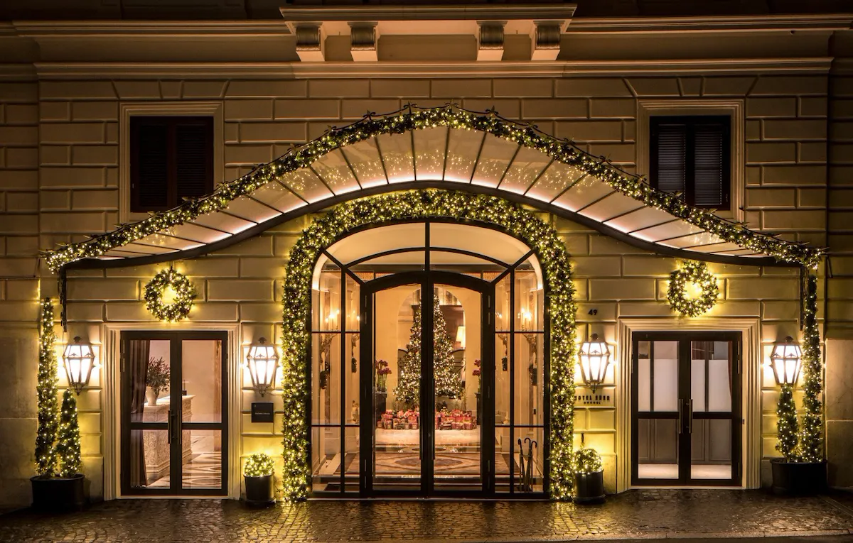 Night shot of Hotel Eden's exterior with Christmas decorations