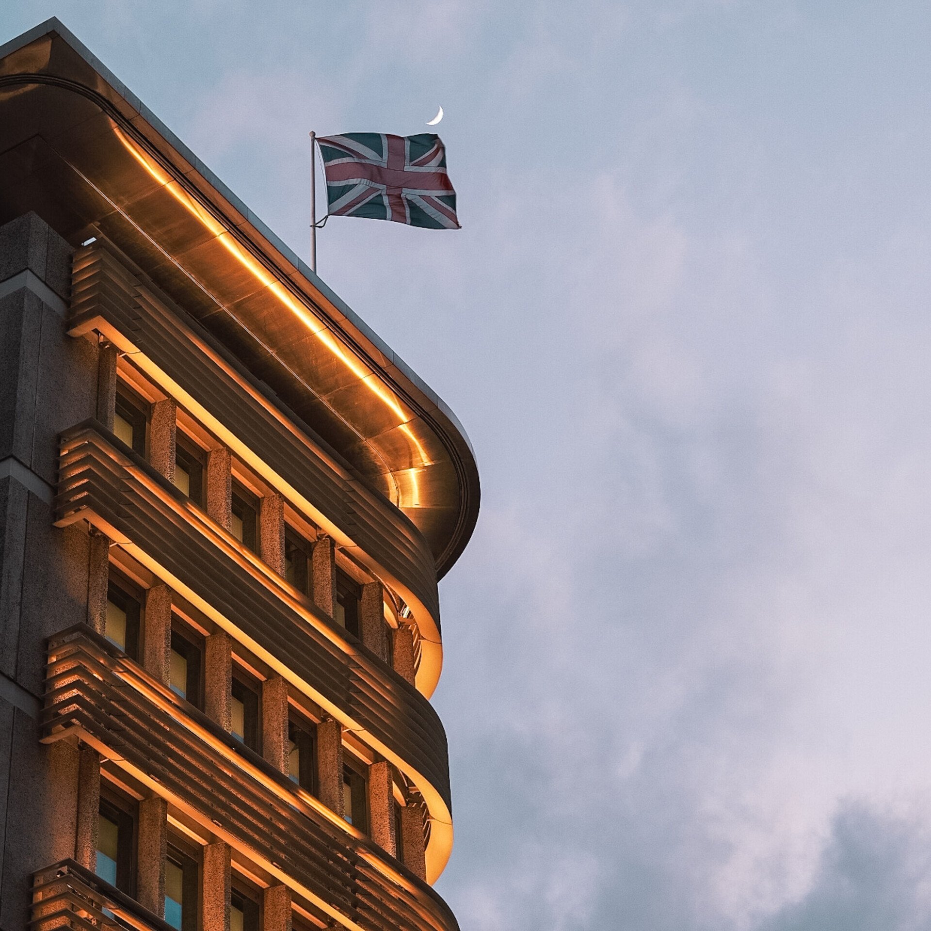 Exterior of hotel lit up at dusk