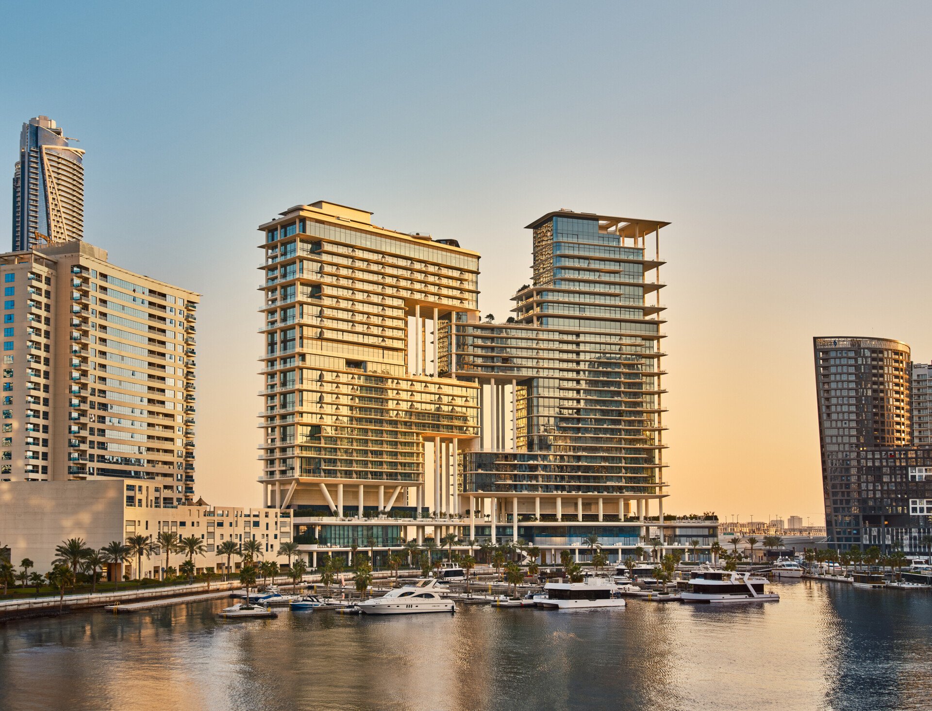 The Lana building viewed from the opposite side of the canal, during sunset