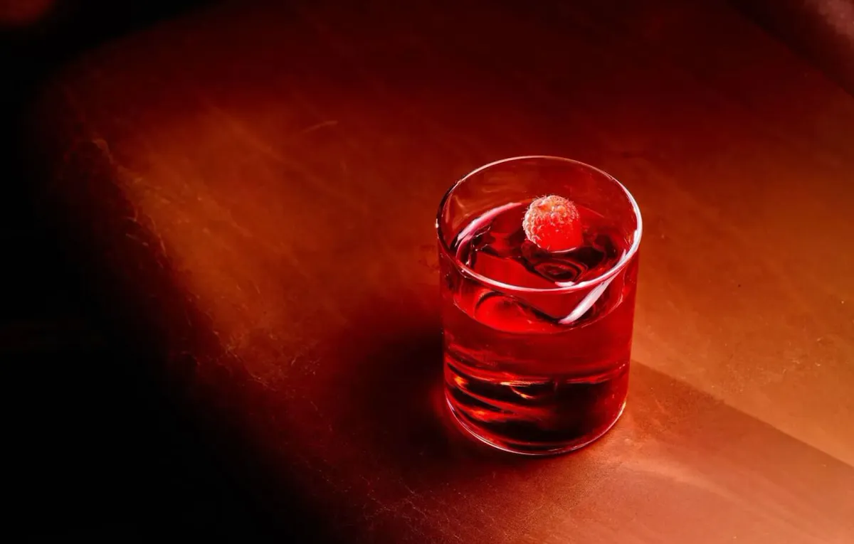 Negroni cocktail served in a cut-crystal tumbler with ice and garnish at The Grill at The Dorchester.