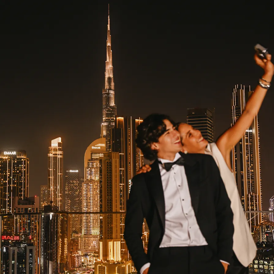 A couple taking photos in High Society