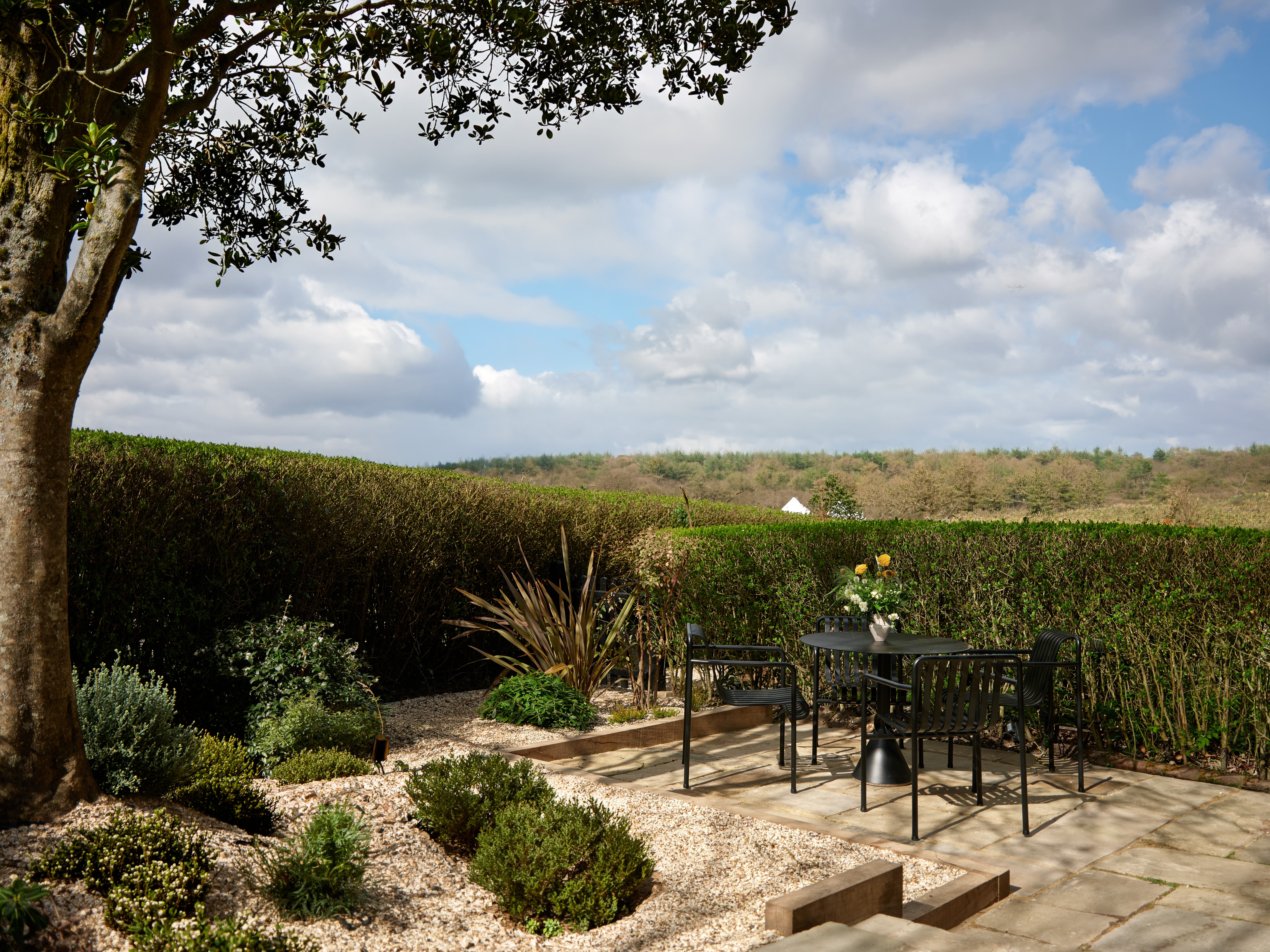 Private garden terrace with countryside views at the Gardeners West suite Coworth Park, Ascot 