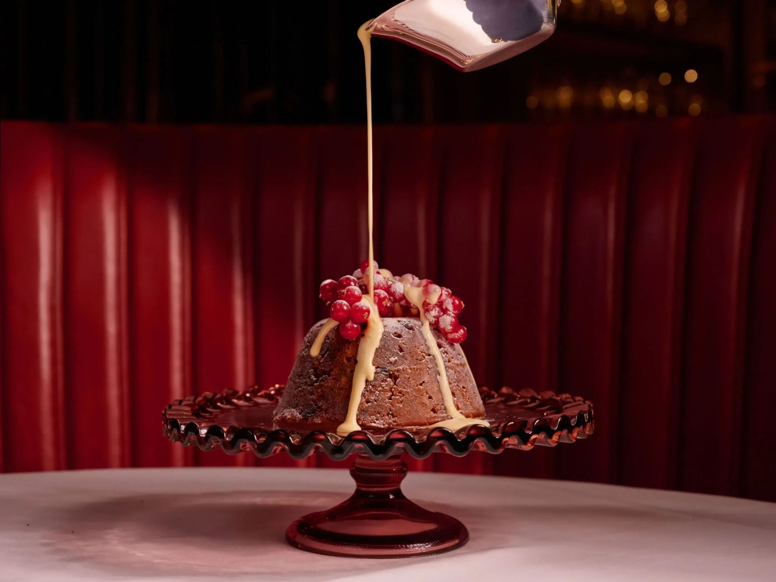 Festive dishes on white table cloth in warm lighting in The Grill at The Dorchester