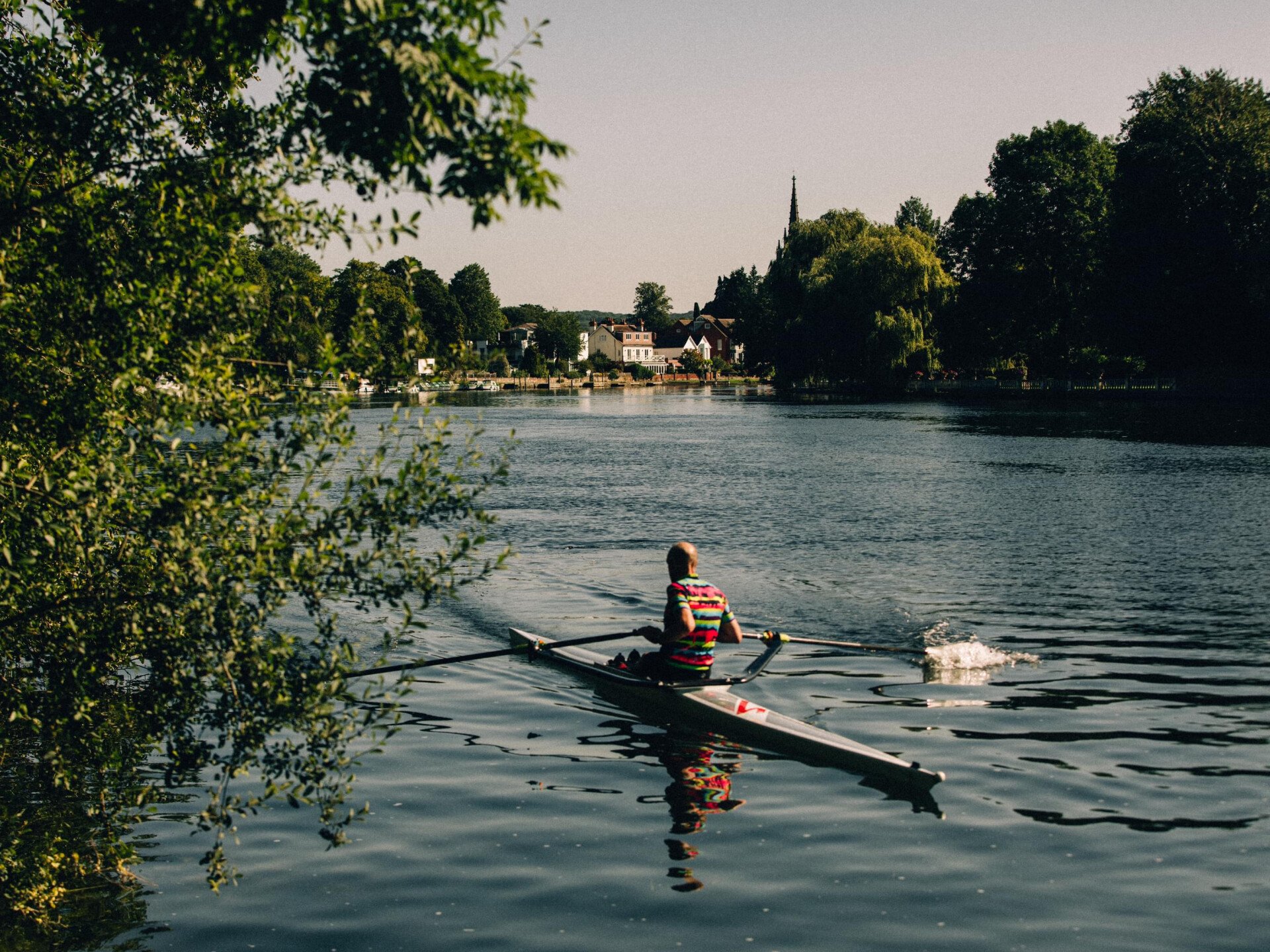 Rower sculling on the River Thames near Coworth Park 