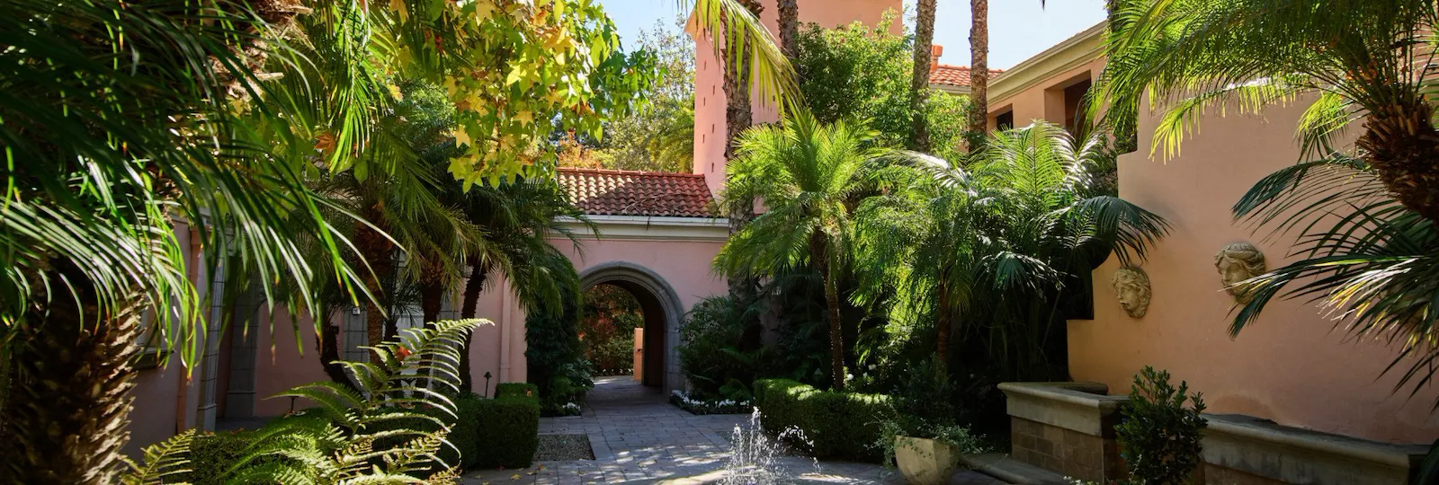 Courtyard with fountain and palm trees at Hotel Bel-Air