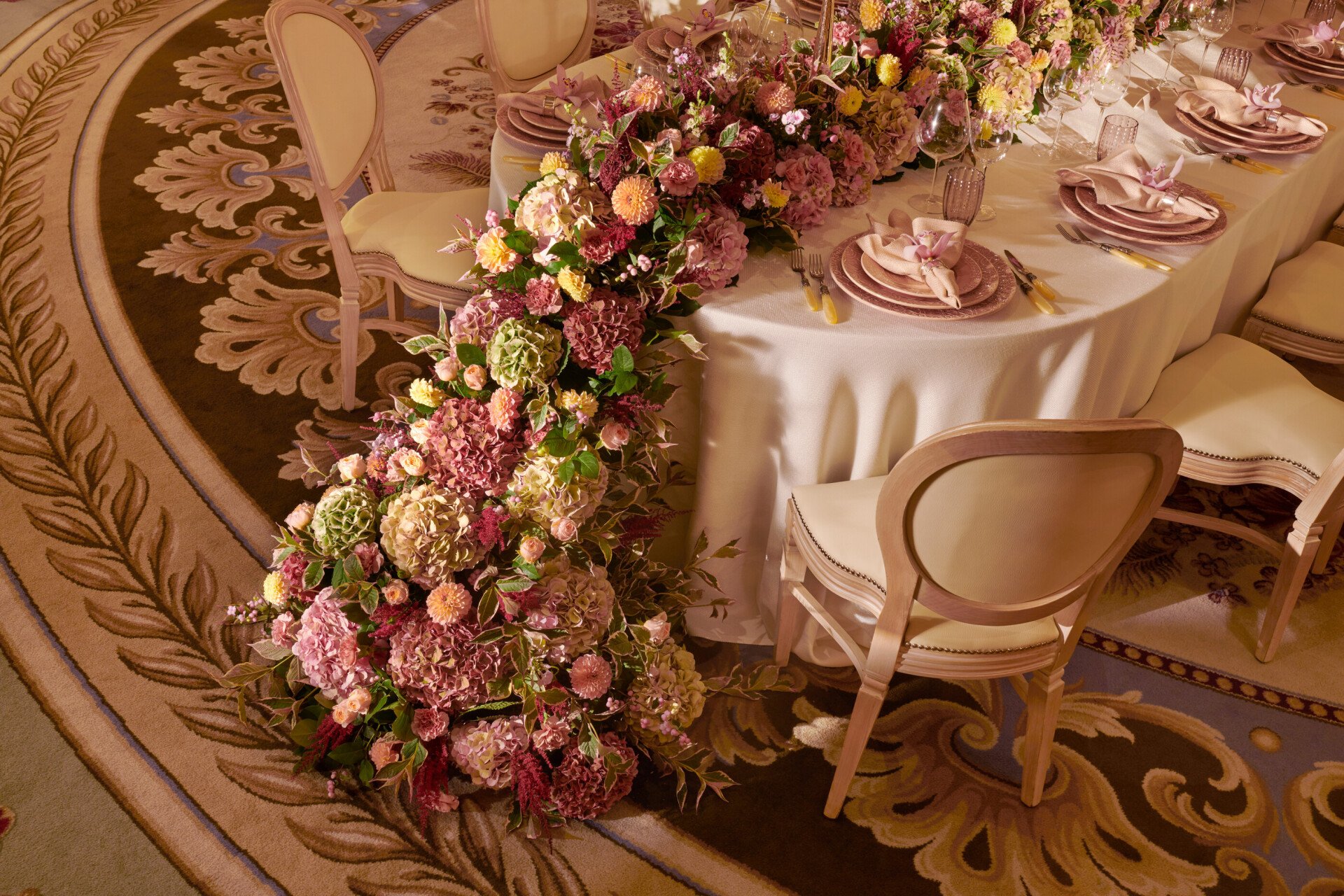 The Dorchester Gold and Silver event space set of  fabulous evening event with a stunning floral centre perice