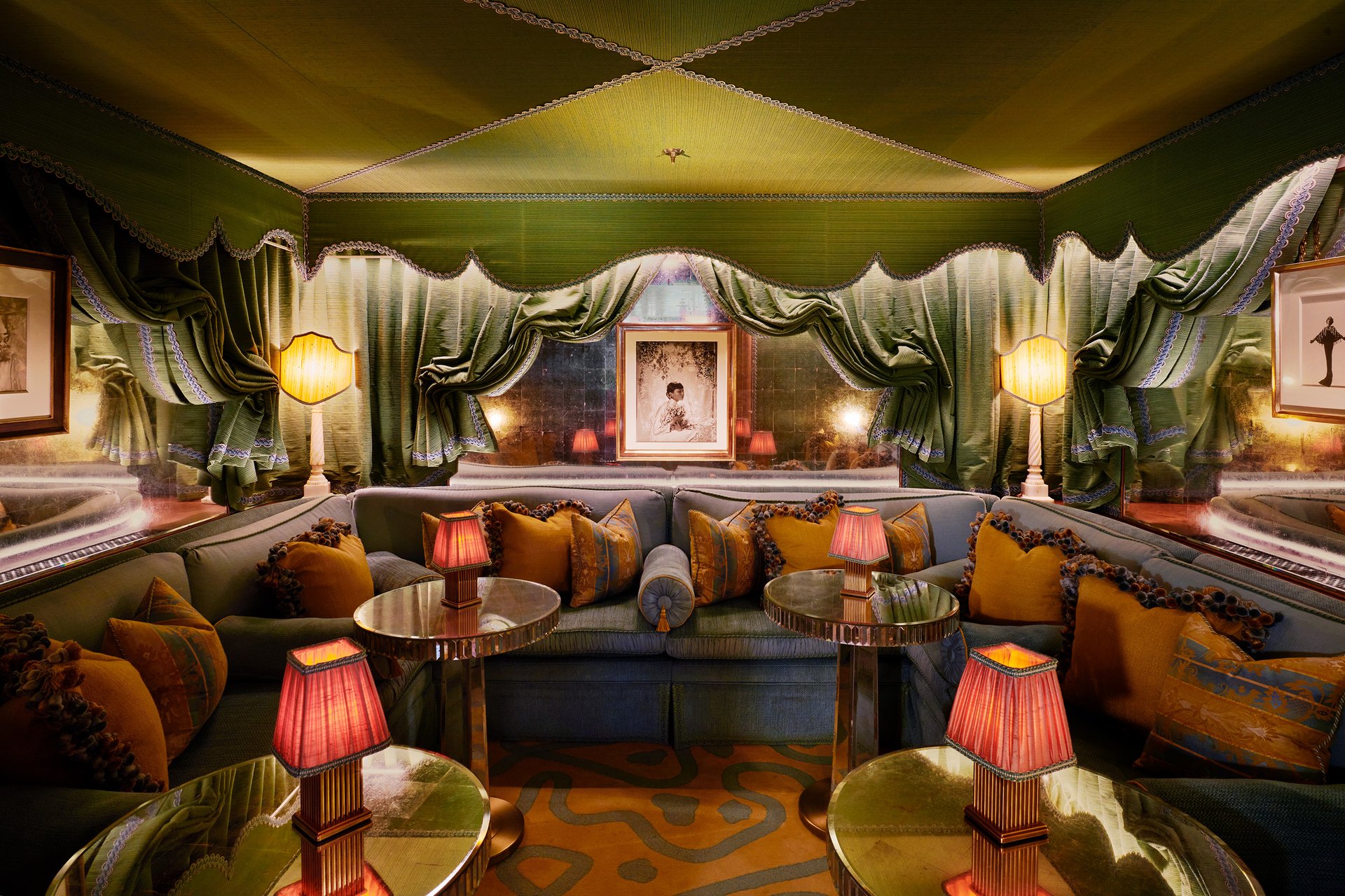 A cozy lounge with plush seating, warm lighting, and elegant curtains creating an inviting ambiance