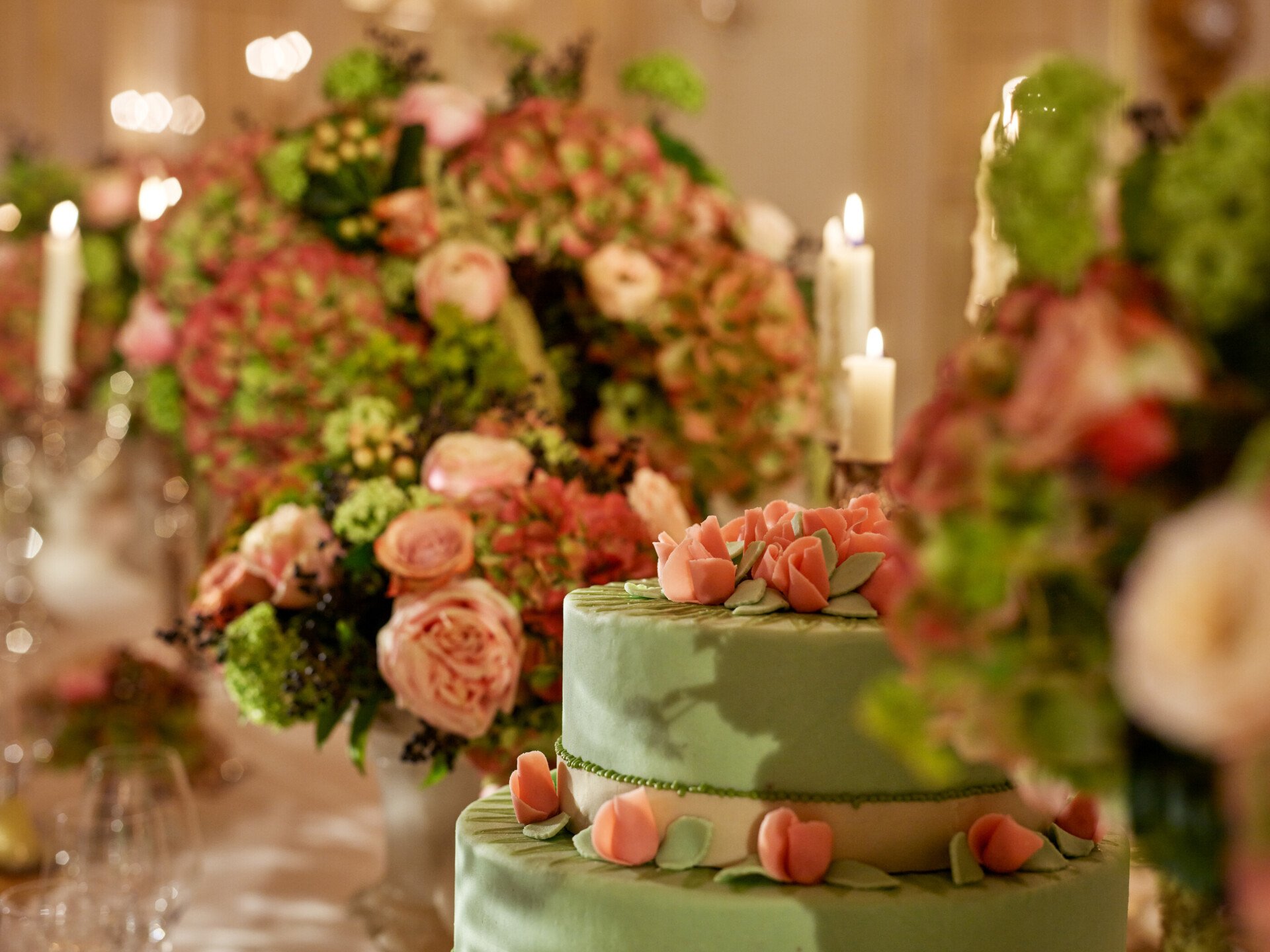 Dinner captured with gold and white tableware, pink and green flowers, green cakes, at Le Salon Organza, at Hôtel Plaza Athénée, Paris - Dorchester Collection.