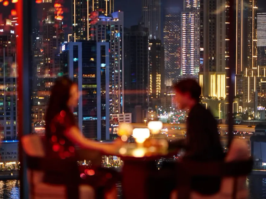A couple enjoying drinks at Jara by Martin Berasategui
