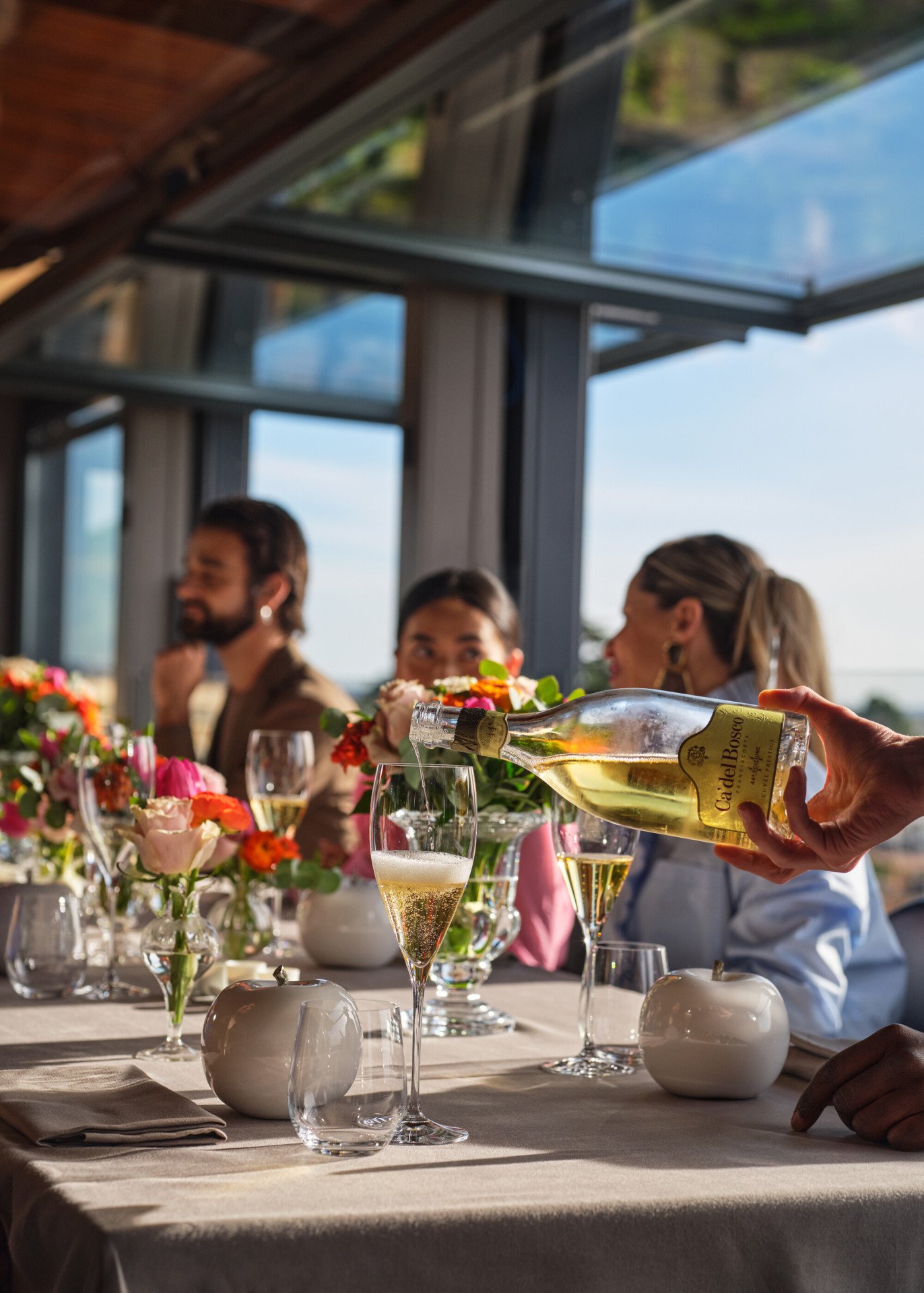 Waiter serving prosecco at La Terrazza 