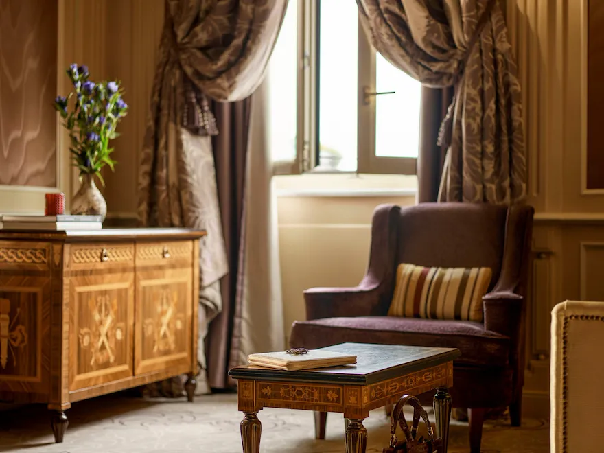 Ambassador Suite Living Room Detail of a brown bag on the floor matching the colours of the pieces of furniture