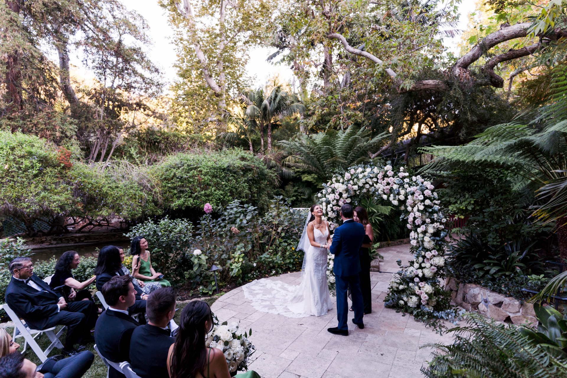 Bride and groom in garden wedding ceremony at Hotel Bel-Air,Los Angeles