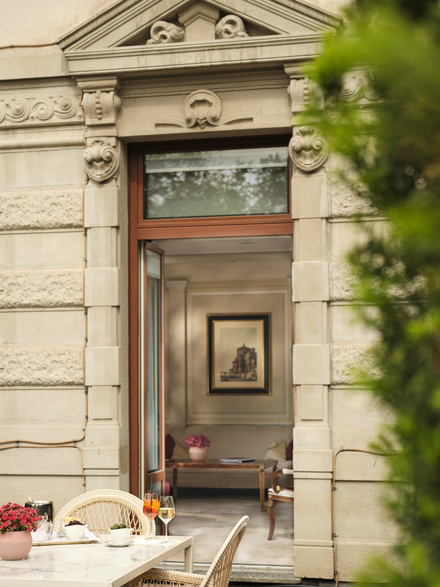 View of the Principe Suite from the Terrace showing aperitif details in the foreground and its design in the background