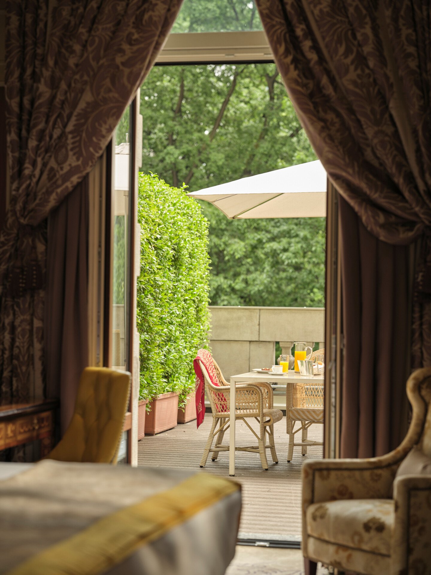 View of the terrace from the Deluxe Terrace Room with a red detail in the background