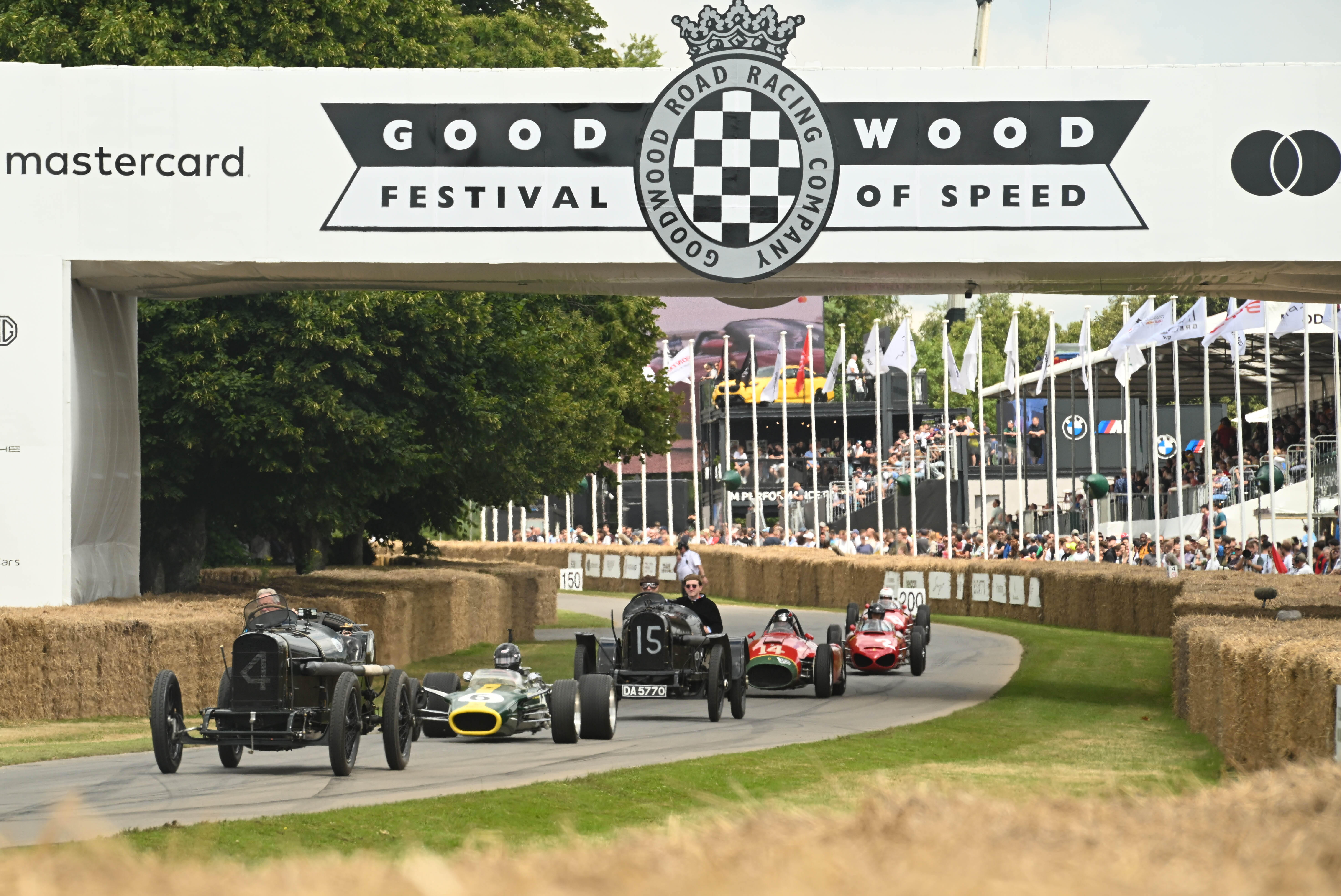 Vintage racing cars on the hill climb at the Goodwood Festival of Speed, near Coworth Park