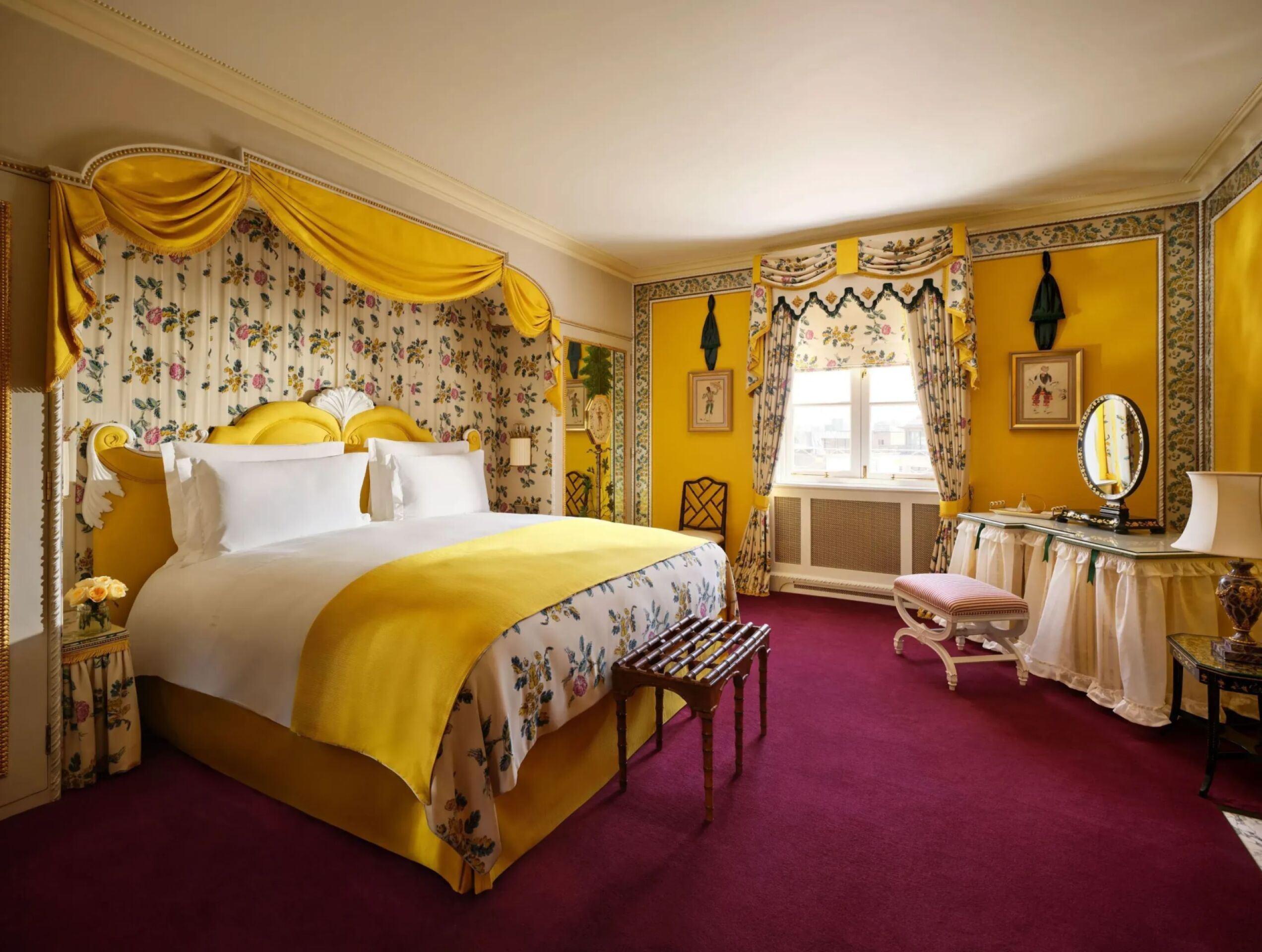 A bedroom in warm yellow hues and matching patterns