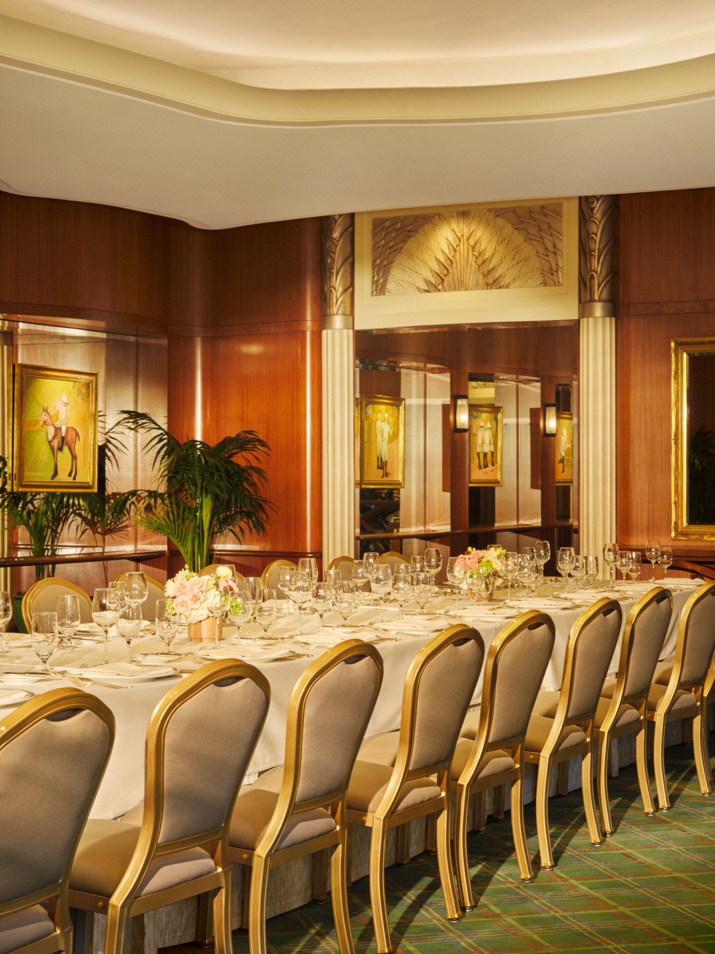 Elegant banquet table set for a formal event in a luxurious decorated room