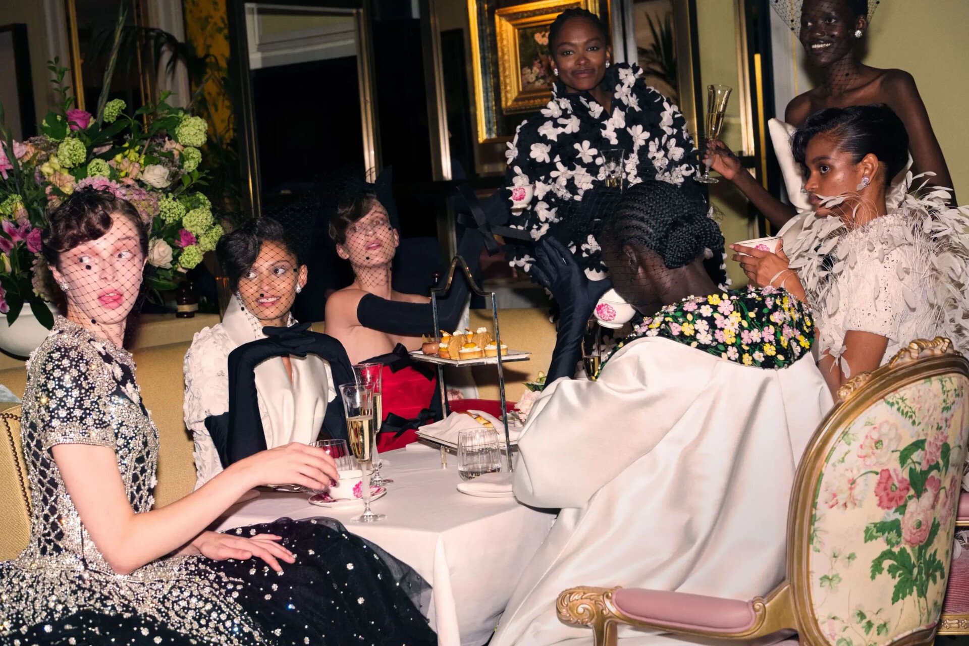 Female models enjoying aftrenoon tea experience at The Dorchester hotel. 
