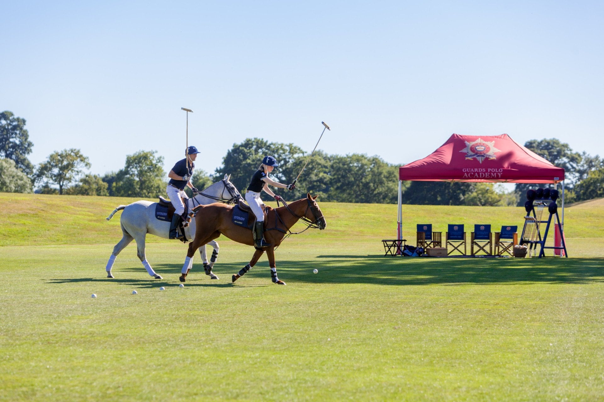 Coworth Park-Guards Polo Academy-lesson-hitting balls in line-highres