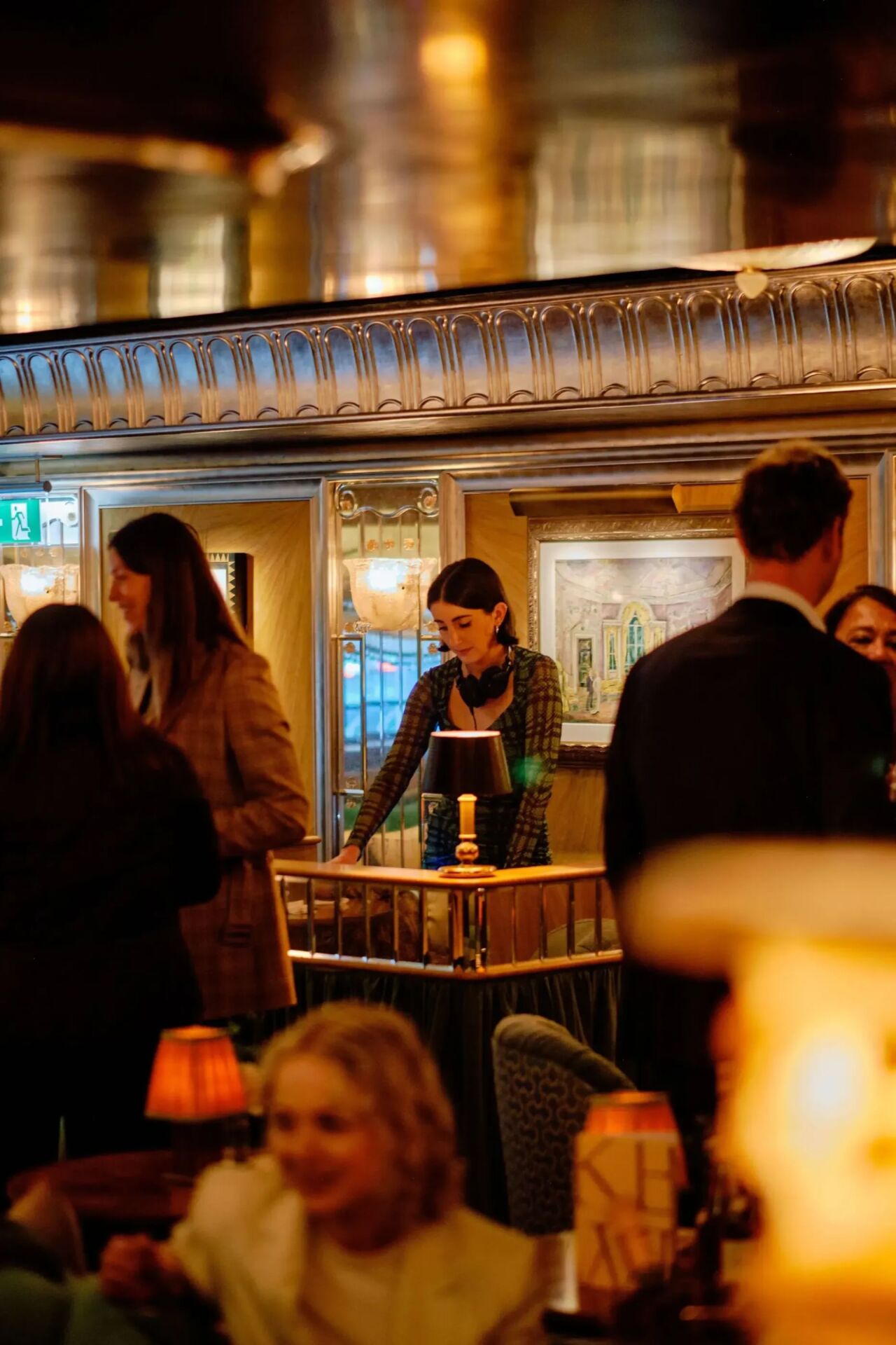 Party Photography at Vesper Bar at The Dorchester, people sitting drinking in the glamorous light of Vesper bar with Cocktail Bartenders creating stunning drinks