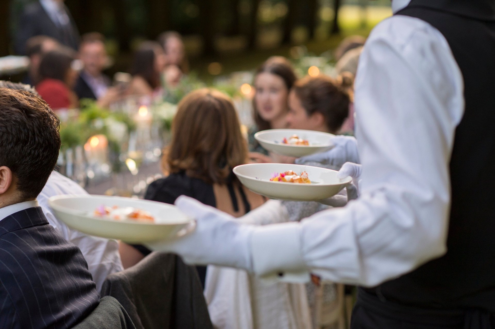 Coworth Park-Events-service-waiter carrying plates-medres2
