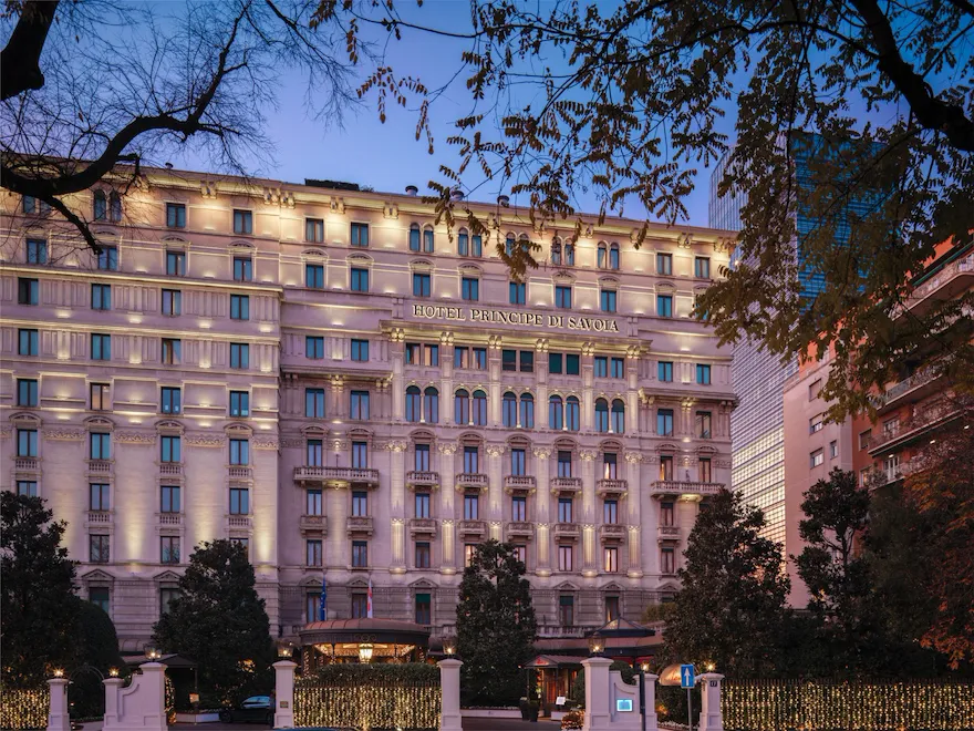 Hotel Principe Di Savoia building exterior lit up at night, Milan
