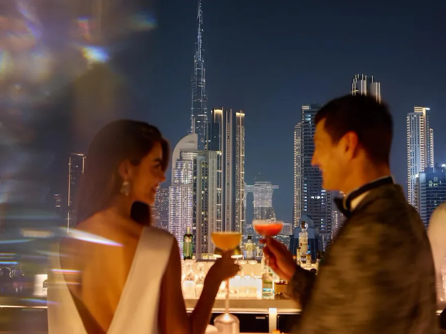 A couple enjoying drinks at High Society