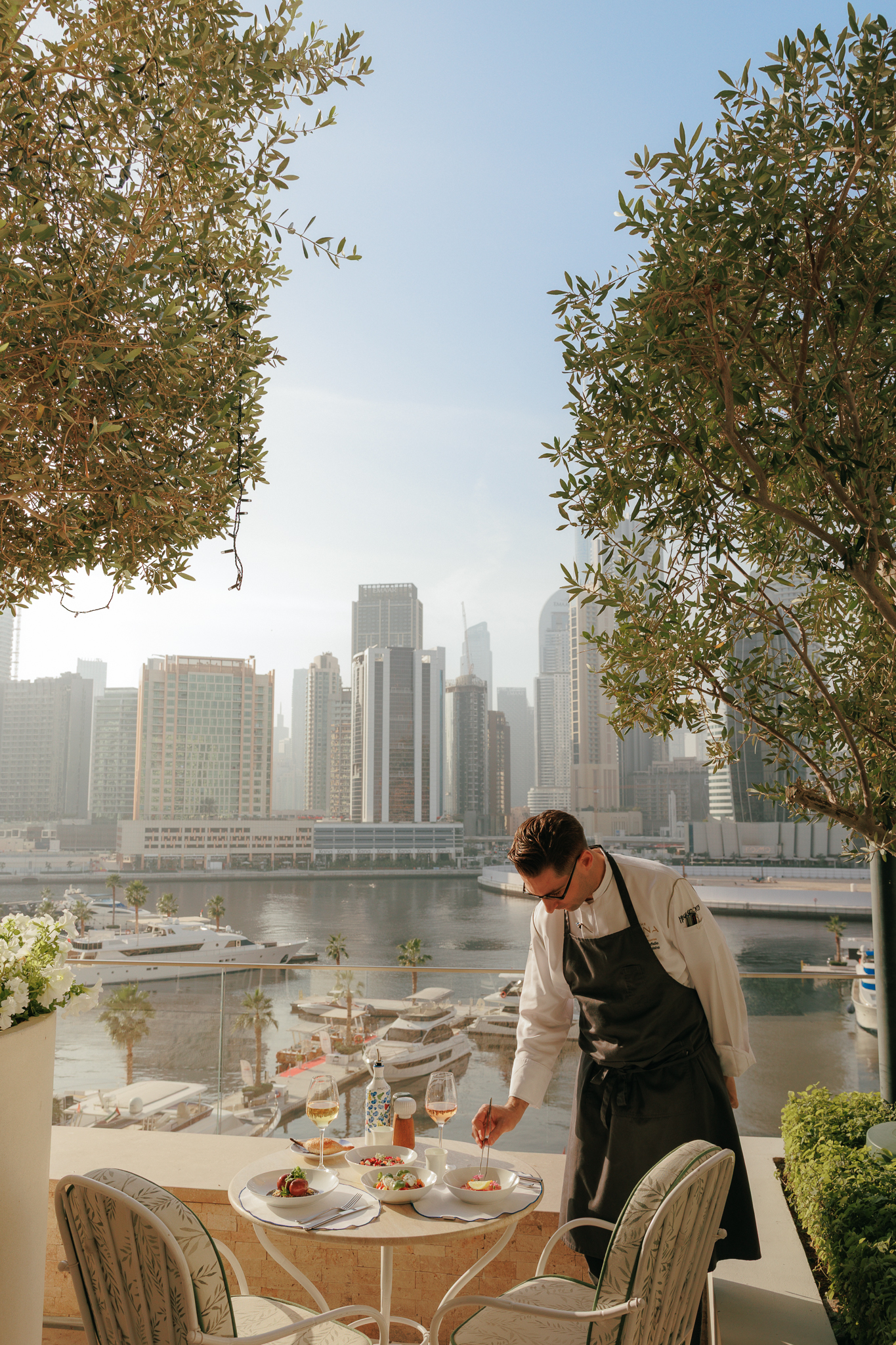 Chef putting the last details in his dish in Riviera terrace
