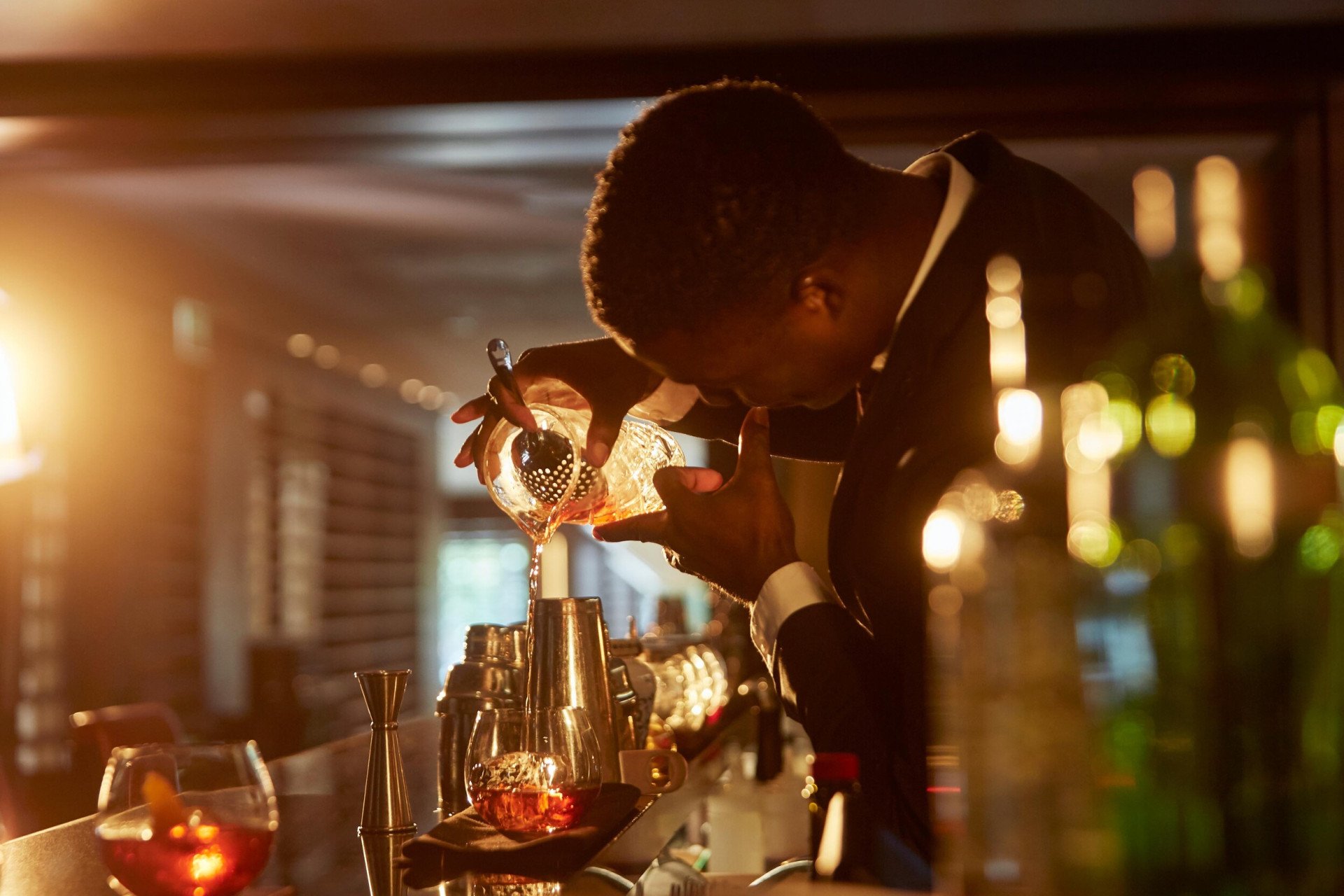A bar man making negroni at Bar 45, London