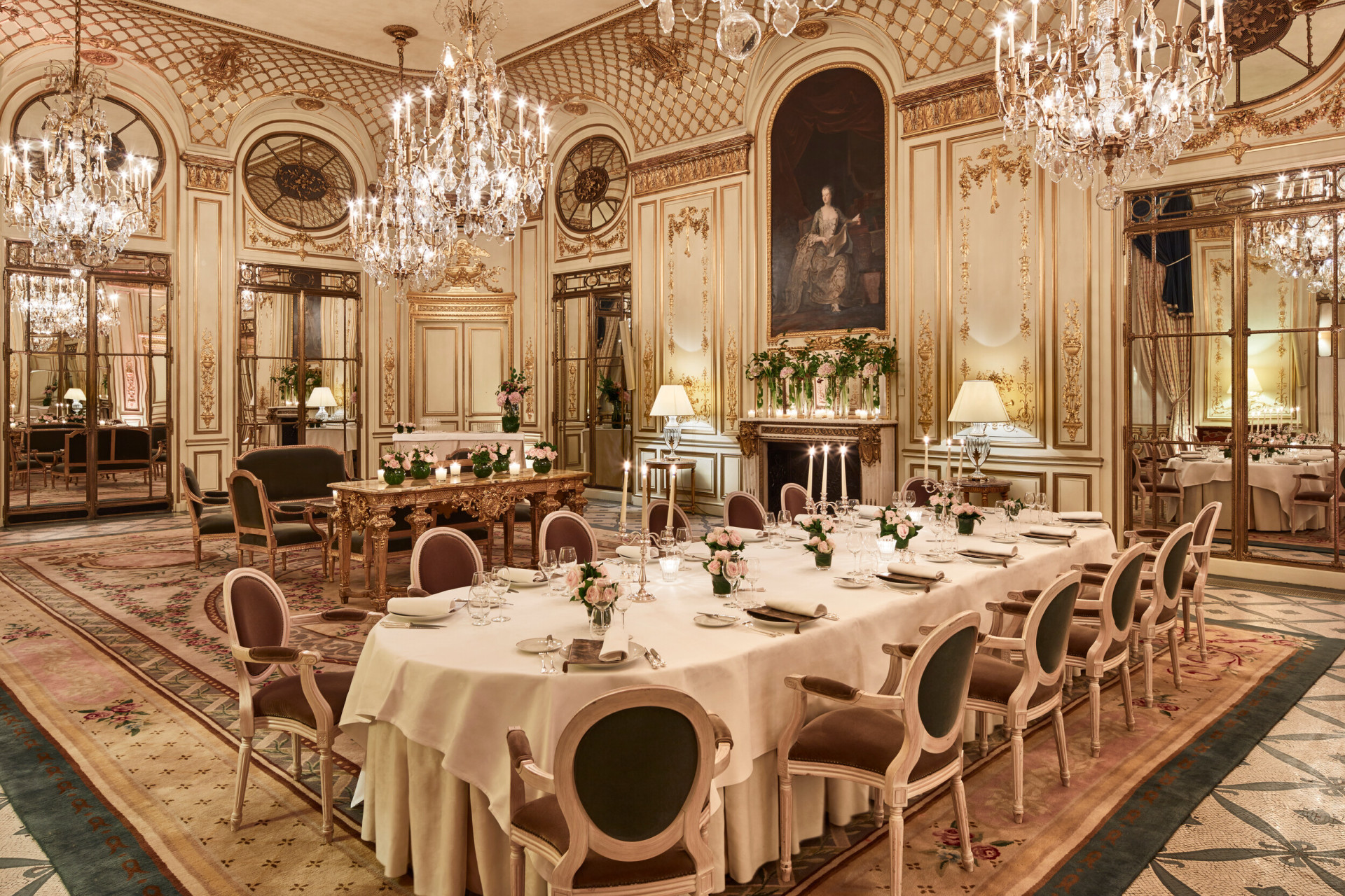 Photo of Salon Pompadour bright Versailles-style event room, set for dinner with round and large dressed tables at Le Meurice, Paris