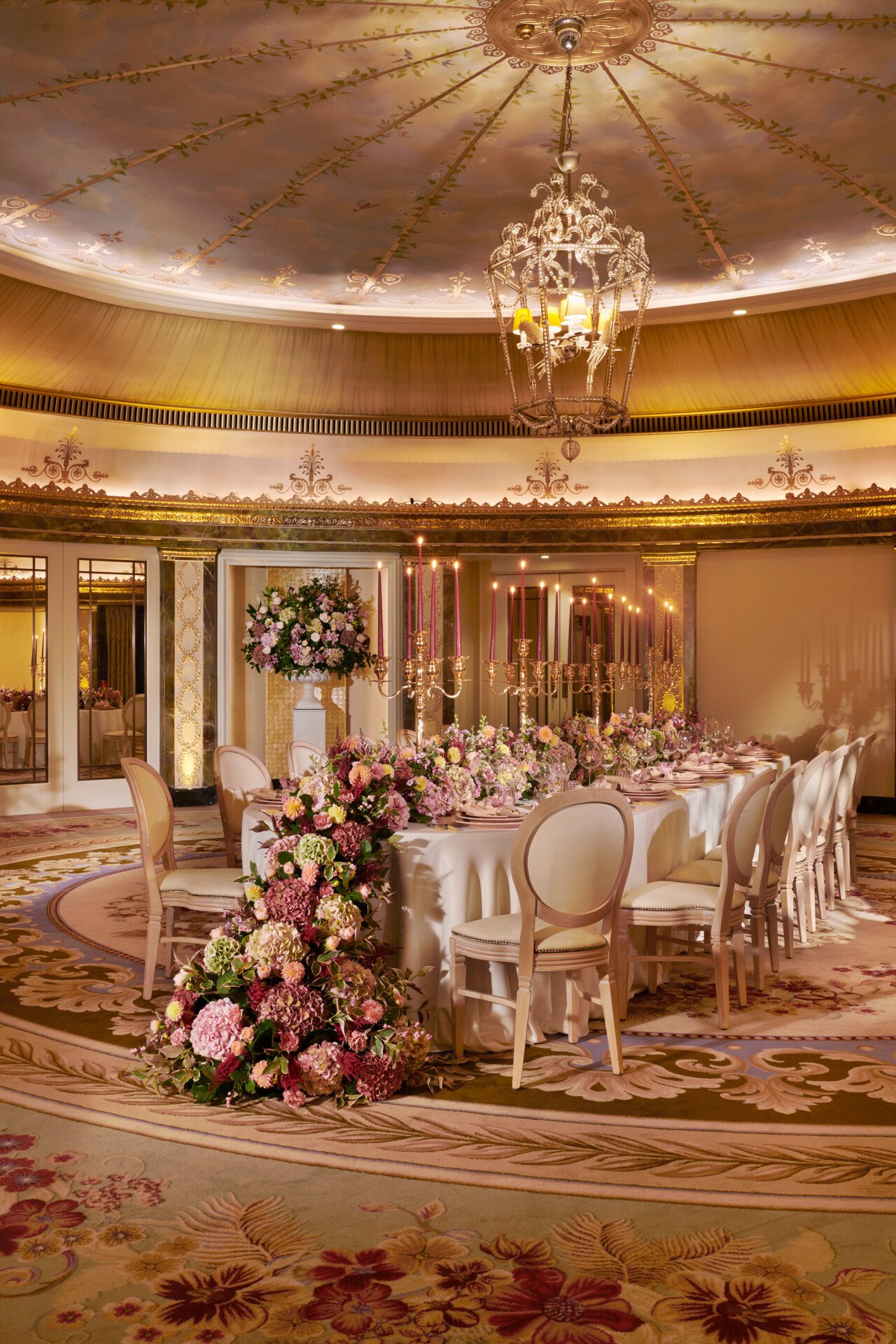 The Dorchester Gold and Silver event space set of  fabulous evening event with a stunning floral centre perice