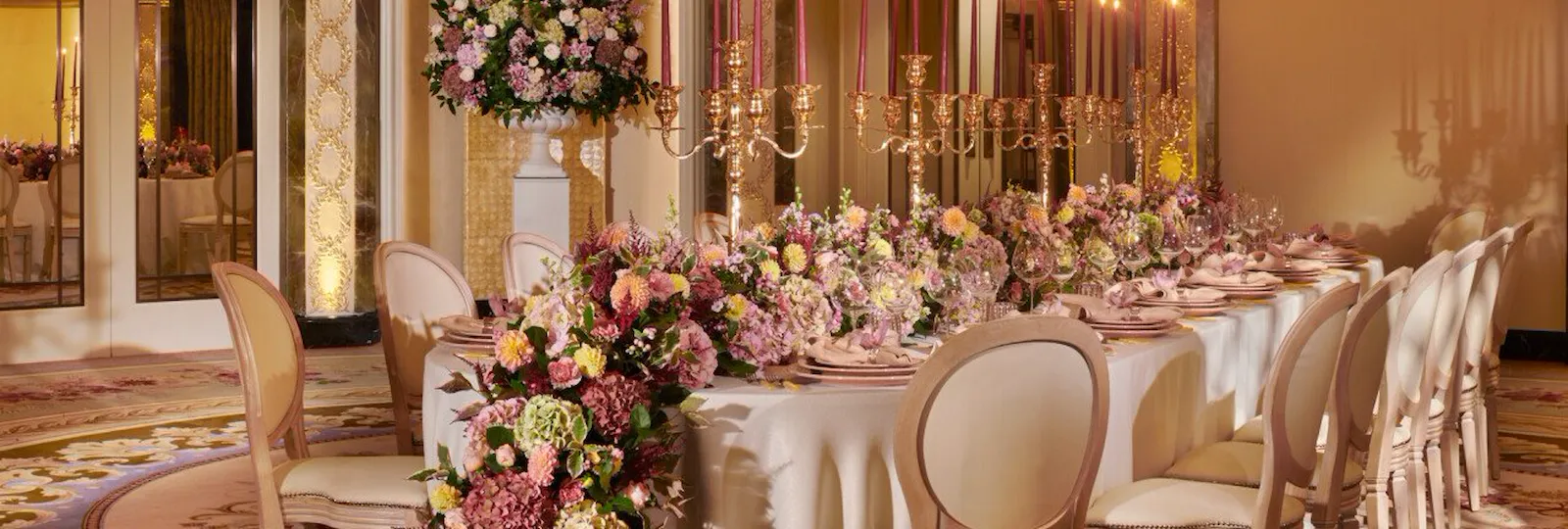 The Dorchester Gold and Silver event space set of fabulous evening event with a stunning floral centre perice