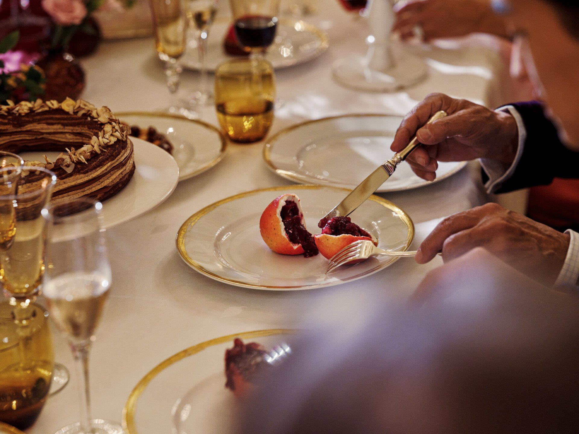 Pomegranate dessert cut into a plate in Le Salon Pompadour at Le Meurice, Paris - Dorchester Collection
