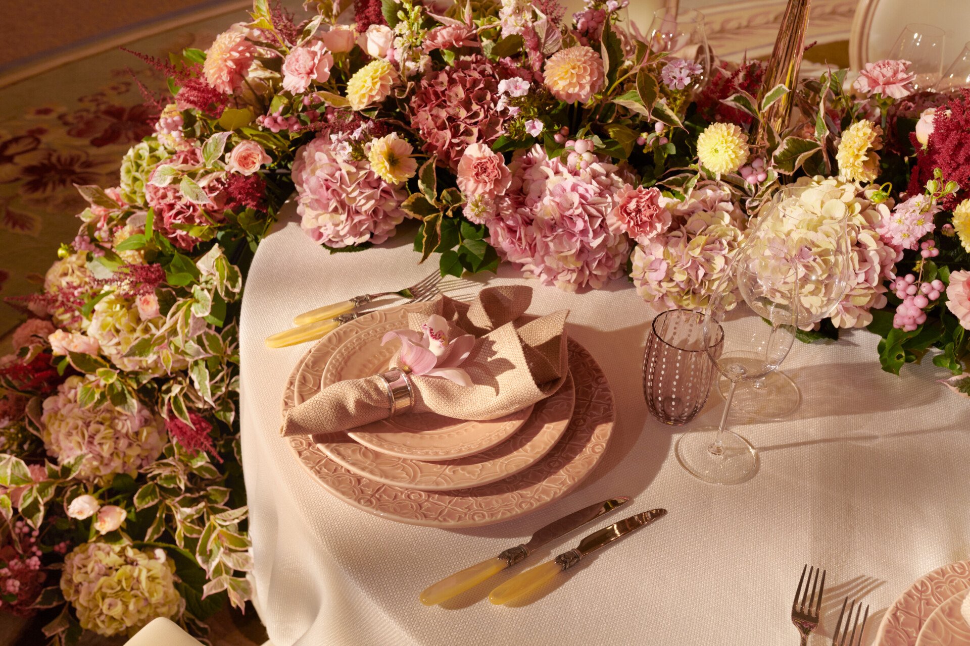 The Dorchester Gold and Silver event space set of  fabulous evening event with a stunning floral centre perice